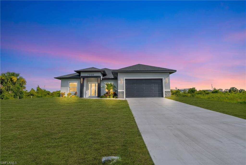 MODERN LUXURY MEETS EXCEPTIONAL DESIGN! Welcome to 7020 Burma Cir, a stunning new construction home where contemporary elegance, thoughtful craftsmanship, and everyday comfort come together. This beautifully designed residence offers 3 spacious bedrooms plus a versatile den, perfect for a home office, guest space, or additional living area. Step inside and experience an impressive open-concept floor plan featuring soaring 10-foot ceilings, gorgeous porcelain tile flooring throughout, and an abundance of natural light. The showstopping kitchen is truly the heart of the home, featuring striking 96-inch cabinetry, sleek countertops, stainless steel appliances, a double oven, and an oversized island with beautiful wood-accent detailing, creating the perfect space for cooking, gathering, and entertaining. Retreat to the luxurious primary suite, complete with a custom walk-in closet featuring built-in cabinetry and a spa-inspired bathroom showcasing dual vanities, a relaxing soaking tub, and a separate walk-in shower. The luxury continues outdoors with an expansive covered lanai featuring a fully equipped outdoor kitchen, built-in grill, and plenty of room to entertain or simply unwind while enjoying Florida's beautiful weather. From the stylish finishes and modern fixtures to the carefully designed indoor and outdoor living spaces, every detail of this home has been selected to impress. Why settle for ordinary when you can have extraordinary? Schedule your private showing today and experience everything this exceptional home has to offer!