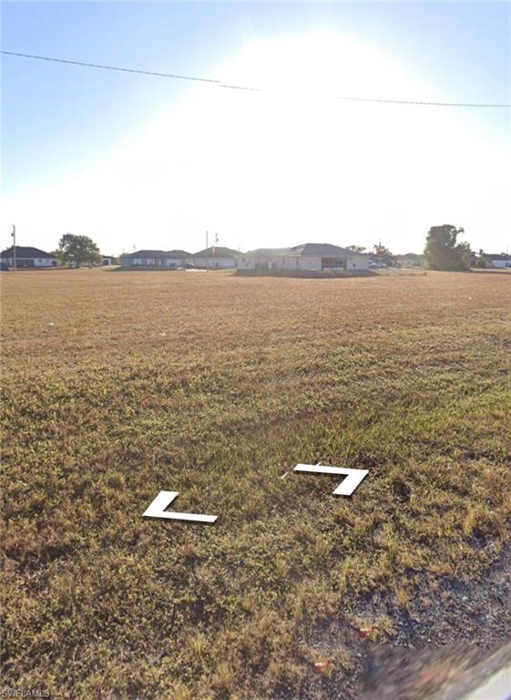 Commercial vacant lot located in Cape Coral offering excellent opportunity for investment. Property is situated in a non-flood zone and provides great potential for a variety of commercial uses. Convenient location with access to surrounding residential and commercial growth. The adjacent lot is also available for sale at a separate price.