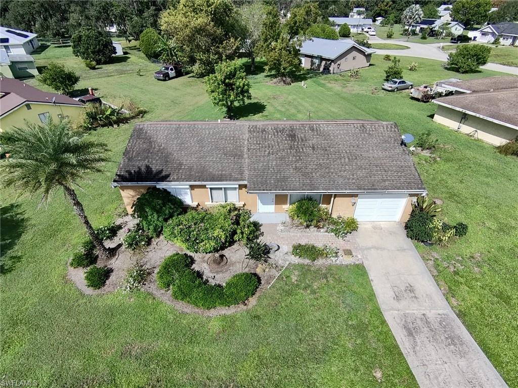 This well-maintained single-family home offers 3 bedrooms, 2 bathrooms, and a functional open-concept kitchen. Inside, you'll find easy-care vinyl and tile flooring, along with a roomy garage with great storage potential. Located in a quiet neighborhood with low HOA fees, it rests on a generous 11,325-square-foot lot that provides abundant outdoor space.
