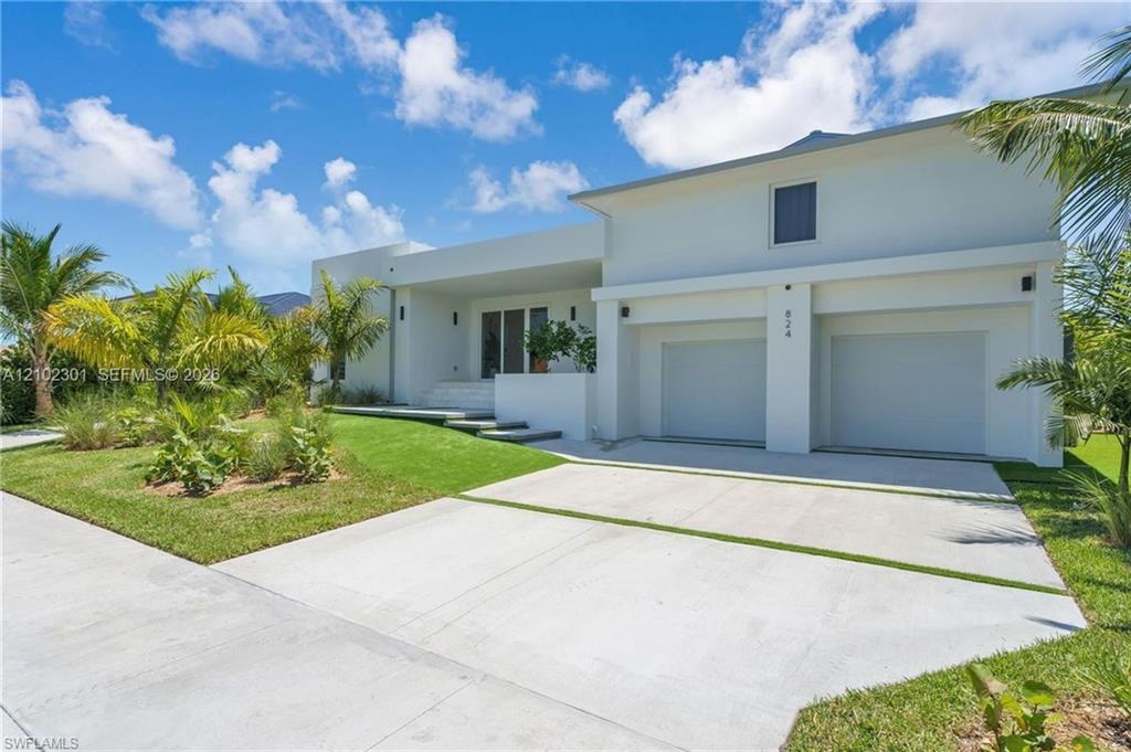 Welcome to your own paradise on Marco Island. Remodeled and expanded in 2025, this warm waterfront home blends modern coastal with the comfort and ease of true island living. Set on a 123 feet wide lot, the home offers, water views, indirect Gulf access to enjoy days on the water. From the moment you enter it feels cozy, bright and effortlessly welcoming. Soft natural light, create a relaxed atmosphere. Sliding glass doors open to outdoors and make it easy to enjoy Marco Island’s beautiful weather throughout the day. Open kitchen/ dinning/ living space designed for everyday living and entertaining. Quartz countertops and floor to ceiling cabinets. Comfortable layout, five bedrooms/ five-bathroom, spacious owner’s suite, two additional guest suites with its own bathrooms. Outside, the home comes alive, tropical backyard oasis surrounds the pool, more than 1600 square feet screen enclosure to enjoy morning coffee, afternoon swims, sunset cocktails, or relaxed evenings with friends and family. The home includes two car garage, impact glass windows and doors, 2 concrete driveway and up to 11,000 pounds boat lift. Minutes from Marco Island’s beautiful beaches, favorite restaurants, shopping, and local attractions, this is more than a beautiful home, it’s a place to slow down, gather with the people you love, and enjoy everything island living has to offer. Come see why this warm and welcoming waterfront retreat feels like home the moment you walk through the door.
