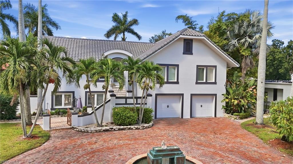 A distinctive riverview estate along Fort Myers' historic McGregor corridor, 1205 Caloosa Drive combines architectural character, exceptional scale and a private waterfront setting just minutes from the River District. Set on approximately 0.69 acre along the Caloosahatchee River, this 1936 residence offers approximately 5,680 square feet of living space with 5 bedrooms, 5 full baths, a private pool and no HOA.

Extensively renovated over the years while retaining the character of its original architecture, the home provides an impressive collection of living and entertaining spaces. Formal living and dining areas are complemented by a home office, game/media space and two kitchens, creating flexibility for entertaining, extended guests or multigenerational living. Hardwood and tile flooring, impact windows and doors, generous room proportions and abundant natural light contribute to a home that feels substantial without sacrificing warmth.

The primary suite takes advantage of garden and water views and offers room for a sitting area, an ensuite bath with dual vanities, soaking tub and walk-in shower, and generous closet space. Four additional bedrooms and baths provide considerable flexibility for family, guests and private work-from-home accommodations.

Outdoor living is central to the property. Mature landscaping and established palms frame the oversized homesite, while balconies and outdoor entertaining areas take advantage of views toward the Caloosahatchee River. The pool, covered lanai, fountains and surrounding hardscape create a private setting for entertaining or relaxing while enjoying the riverfront environment.

Located just off historic McGregor Boulevard, the property offers convenient access to downtown Fort Myers and the River District while maintaining the privacy and presence of an established residential estate. With direct river frontage and boating access, the location provides an opportunity to enjoy the waterfront lifestyle for which Southwest Florida is known.

The residence would benefit from some minor repairs, refreshing and personalization, providing the next owner an opportunity to make this significant property their own while building upon its existing architecture, scale and improvements.

Property is being sold AS-IS. Buyers are encouraged to conduct their own inspections and independently verify the condition and functionality of all systems, components, appliances, improvements, pool and waterfront features, as well as permitting, flood information and any other matters important to their purchase.

Agents: Please review all private remarks and MLS supplements prior to scheduling a showing or submitting an offer.