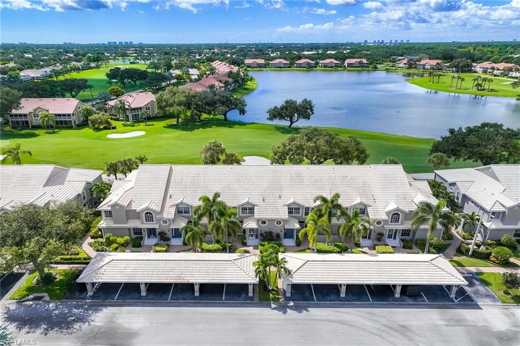 Immediate full golf membership included with no waitlist! Plus, an active tennis community. End unit, second-floor condominium offers golf course views overlooking the third hole, with western exposure. The three-bedroom, two-bath residence features an open floor plan, vaulted ceilings, an exterior storage closet, dedicated carport and ample guest parking that complete the residence. Residents of Cavendish Court enjoy exclusive access to a private pool with an outdoor grilling station, tennis and pickleball court. Worthington Country Club offers an active lifestyle with access to an 18-hole championship golf course, five Har-Tru tennis courts, a well-appointed clubhouse offering elegant dining, a state-of-the-art fitness center, a resort-style pool and poolside cabana. All conveniently near Bonita Beach, Southwest Florida International Airport, and premier shopping and dining venues. Next door, an exciting new development, Midtown at Bonita, is set to open in 2026 with new dining and retail. Club enhancements are in progress, including five new tennis courts, four pickleball courts, and a new indoor-outdoor cabana featuring an electric pergola, with no special assessment for property owners.