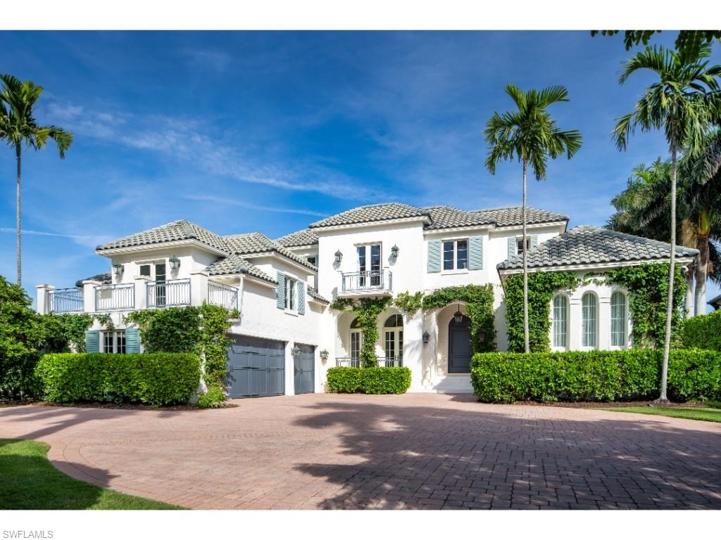 Perfectly positioned along the tranquil waters of Runaway Bay, this beautifully reimagined Port Royal residence offers an elegant blend of contemporary refinement and timeless sophistication. The interiors were thoughtfully transformed with clean, modern finishes, curated fixtures, and exceptional attention to detail—reflecting a globally inspired design aesthetic. A remarkable entry foyer with a striking stairway sets an impressive tone upon arrival, leading to an array of beautifully proportioned living spaces. The formal living and dining rooms are gorgeous and light-filled, while a cozy den with custom built-in shelving provides a warm, intimate retreat. The renovated kitchen, appointed with Ruffino cabinetry and thoughtful upgrades, flows effortlessly into a functional family room and the expansive covered outdoor living area. A custom glass wine room adds a focal point and a touch of understated luxury. The home’s highly functional configuration includes six spacious bedrooms, each with its own ensuite bathroom. The first-floor primary suite offers convenience and privacy, while five additional guest suites are located upstairs along with a large exercise room and a secondary loft office. Upgraded bathrooms throughout further elevate the home’s contemporary feel. Situated on a unique and well-proportioned Port Royal lot, the property features a spacious three-car garage with a large motor court and enjoys an exceptional position on sought-after Spyglass Lane. Boaters will appreciate the property’s no-bridge access to Naples Bay, the Gulf, and the surrounding estuarine waterways. The home’s elevated living experience is further enhanced by updated lighting and AV controls, security cameras, and motorized window shades. An outstanding opportunity to secure a residence in Port Royal and enjoy the newly completed Port Royal Club beachfront clubhouse, offering an exceptional new chapter in luxury coastal living. This property is eligible for Port Royal Club membership.