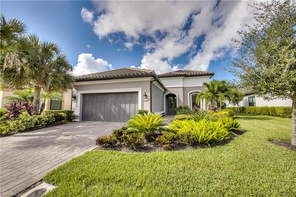 Exceptional upgraded Farnese model with 2 bdrm+den (could be 3ed bdrm), 2.5 bath, 2 car garage with gas heated pool & spa, in Pebble Pointe. Lanai furnishings included in sale! Beautiful Turkish marble pavers, gas fireplace, summer kitchen with stand alone grill, extended undercover outdoor living space, electric hurricane shutters, picture screen window & southwestern exposure all enhance the FL outside lifestyle.  Easy entertaining inside with open concept living with large great room, eat-in-kitchen, breakfast bar and dining room. Gourmet kitchen features gas cooktop with hood, center island, stainless steel appliances, wine cooler, 42" cabinets, quartz countertops, tiled backsplash & laminate wood flooring in main living areas. Additional upgrades include whole house impact windows, pocketing sliders, custom window treatments, water purification system, customized closets in bedrooms, lanai security camera, flat screen TV's, solid core 8' doors, garage has 4' extension, garage Tek storage system and acrylic flooring plus much more. Pebble Pointe is a gated, natural gas community, no CDD, lower HOA fees, dog park, dedicated traffic signal for entrance & exit. Great location!