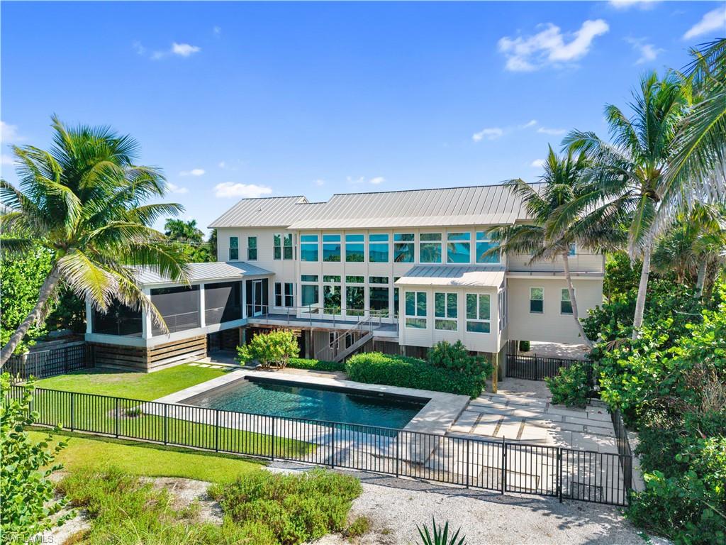 MAJOR PRICE REDUCTION. EVEN BIGGER OPPORTUNITY. NOW $6.2 MILLION! This may be one of the most compelling beachfront opportunities Captiva Island has seen in years. Once offered at $12 million and having attracted multiple offers at substantially higher levels, this exceptional Gold Coast estate is now being offered at a price approaching land value. The sellers are ready to make a move, creating an extraordinary opportunity for the next owner. Located along one of the most coveted stretches of Captiva’s Gold Coast, 16512 Captiva Drive sits among some of the island’s finest beachfront estates. This stretch is known for its exceptional beach, beautiful natural dunes, wide sandy shoreline and spectacular Gulf and sunset views. The location, the beach and the land are simply irreplaceable. And unlike many properties trading near land value, there is already a substantial and beautiful estate here. The main residence and separate guest house offer 7 bedrooms and 5.5 baths, soaring ceilings, dramatic walls of glass overlooking the Gulf, hardwood and shell-stone floors, beautiful woodwork, a beachfront pool, expansive screened lanais and a rooftop sundeck.Enjoy it as it is, renovate and put your own signature on it, or take advantage of the exceptional homesite and create something truly extraordinary. The possibilities, and the upside, are tremendous. At $6.2 million, opportunities like this simply do not come along often on Captiva. Compare the location. Compare the beachfront. Compare the land. Compare the surrounding sales. Then compare the price. This is an exceptional opportunity to own a premier Gold Coast estate at a value that demands attention.