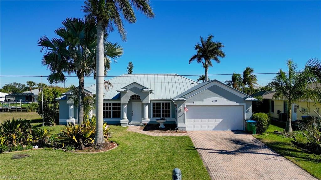 Great Opportunity to Own a Gulf Access 4 Bedroom plus Den with 2230 square feet of Living Area. It was Built in 2004 and has a Vanishing Edge Heated Pool and Spa! Enjoy Florida Living at it's Finest! This home features High Ceilings, a Large Open Kitchen with newer Stainless Appliances, a Breakfast Bar and Formal Dinning. The Metal Roof was installed in 2021, AC and Pool Heater about the same time. Several Glass Sliders open up to the Pool area which makes it Perfect for Entertaining. With 3 Bedrooms and a Pool Bath on one side and the Primary Bedroom on the other, this Split Plan is great for having family or friends come and visit. The Owners Suite is large and also has Glass Sliders that open to the pool. The Spacious Bathroom has a Large Soaking Tub, Separate Shower and Dual Sinks. This House is located in the Pelican Area near Parks and Schools. Close to Vibrant Downtown Cape Coral with all it's Popular Restaurants, Bars, Shopping, Health Care and Festivals. Fish, Kayak or Paddleboard from your backyard or Boat to the Beaches and Islands of Sanibel, Captiva, Ft. Myers Beach or Cayo Costa State Park. Eat a Cheeseburger in Paradise and experience the Beauty at Cabbage Key and the Outer Islands. World Class Fishing is Waiting for YOU! Centrally located with quick access to Ft Myers, Veterans Pkwy or the Pine Island Road Corridor. Access to RSW Ft Myers and PDG Punta Gorda Airports!