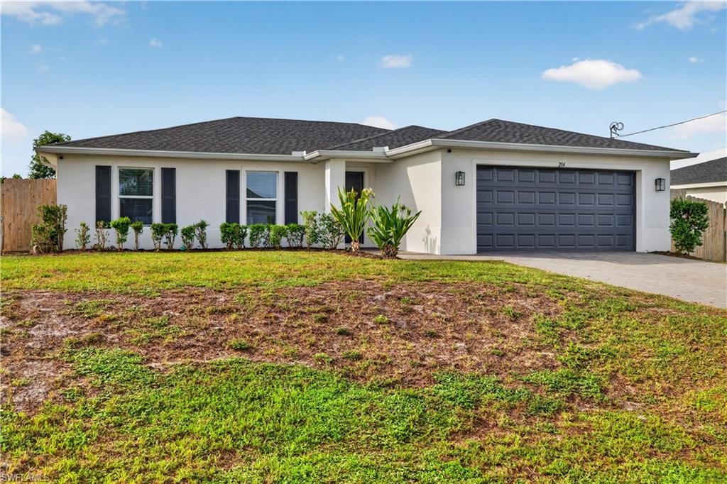 First Class meets Affordability in this like new 4 bedroom 2 full bath single family home available for immediate occupancy. NW Cape Coral's newest neighborhood! Do you need a large yard with fence, sprinkler system and privacy trees already installed? Modern kitchen with island, new stainless steel LG appliances including convection range with air fryer, side by side refrigerator and granite counter tops. Large primary bedroom with en suite and walk-in closet. Need more room? The 2 car garage has its own separate HVAC system, built in cabinets and luxury vinyl plank flooring making it the perfect flex space. Park in it, work in it or let the kids go wild! Need even more? Seller will convey the mounted, brand new, 75 inch flat screen TV for a quick close.