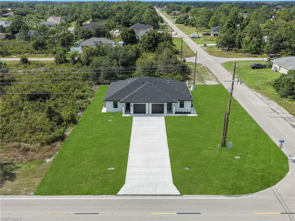 Discover this brand-new duplex built in 2026 in Lehigh Acres! Conveniently located near State Road 82, shopping, schools, and a school bus stop, this beautiful property combines modern design, comfort, and functionality. It features elegant matte porcelain tile flooring, impact-resistant Low-E windows, high ceilings, and an open-concept kitchen with quartz countertops, white Shaker cabinets, and stainless-steel appliances. Enjoy a spacious master suite, contemporary fixtures, ceiling fans, four full modern bathrooms with spacious showers, and a convenient laundry area in the garage. A perfect blend of modern finishes and everyday convenience. Don't miss the opportunity to make this beautiful property your new home