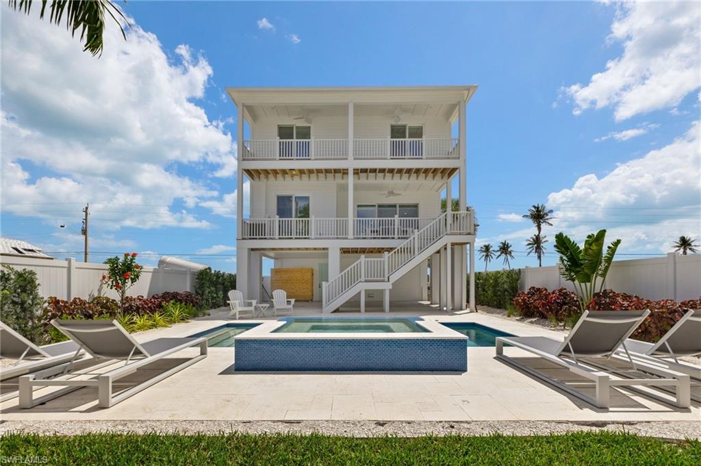 -Experience the very best of the Fort Myers Beach lifestyle in this exceptional 5-bedroom, 4.5-bath luxury coastal residence, ideally positioned just across the street from the Gulf of America with convenient dedicated beach access to both the north and south. Offering direct Gulf views, a private pool and spa, elegant furnishings, and highly sought-after weekly rental zoning, this sophisticated residence presents an extraordinary opportunity for both personal enjoyment and income-producing ownership.
-Beautifully furnished and exceptionally maintained, the home has been gently used with a limited rental history, allowing the next owner to enjoy a residence that feels remarkably fresh while benefiting from proven appeal as a short-term vacation rental. Offered fully furnished and turnkey, it is ready to enjoy from day one—or to continue as a premier Fort Myers Beach vacation rental.
-Inside, refined coastal design meets effortless functionality. The expansive open-concept living spaces are framed by designer-selected finishes, luxury flooring, custom lighting, bespoke cabinetry, premium appliances, and sophisticated coastal furnishings. The generous floor plan offers multiple private bedroom suites, beautifully appointed bathrooms, and comfortable gathering spaces designed for both intimate relaxation and memorable entertaining.
-The outdoor living experience is equally impressive. A custom pool and spa create a private resort-like sanctuary, perfect for an afternoon swim, sunset cocktails, or unwinding after a day along the Gulf. With generous outdoor space and the beach just steps away, the home captures the essence of elevated coastal living.
-Thoughtfully constructed with modern hurricane-resilient standards and storm-protection features, the residence combines peace of mind with timeless coastal sophistication.
-Its location is the ultimate luxury: Gulf views, easy beach access, and proximity to everything that makes Fort Myers Beach so desirable. Spend the morning walking the shoreline, return home for an afternoon beside the pool, and finish the day surrounded by the comfort and privacy of your own coastal retreat.
-Whether envisioned as a Luxury second home, Fort Myers Beach vacation property, turnkey short-term rental, investment property, or a combination of all three, this residence offers a rare blend of location, design, lifestyle, and income potential.
 An exceptional Gulf-view property in a coveted weekly rental zone—beautifully furnished, thoughtfully designed, and ready for its next chapter.