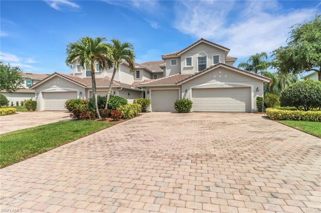 Imagine yourself relaxing on your large, covered lanai overlooking a tranquil lake in this lovely condo at Verandah.  This spacious home has vaulted ceilings, almost 2000 sq ft of living space and an attached garage.  The kitchen has upgraded granite countertops with a beautiful tiled backsplash, and newly updated kitchen cabinets.  The interior was recently painted and includes upgraded lighting and ceiling fans.  The screened-in lanai has plenty of room to enjoy outdoor living and dining.  The third bedroom is overly large and can easily be used as a den with room to spare for bedroom use. New water heater., and new roof in 2023. Verandah offers over 9 miles of walking and biking trails, two championship golf courses, tennis, pickleball, free use of kayaks for the Orange River and many other social activities.  There is also a wonderful dog park for the furry residents and the Manatee Park is close by.