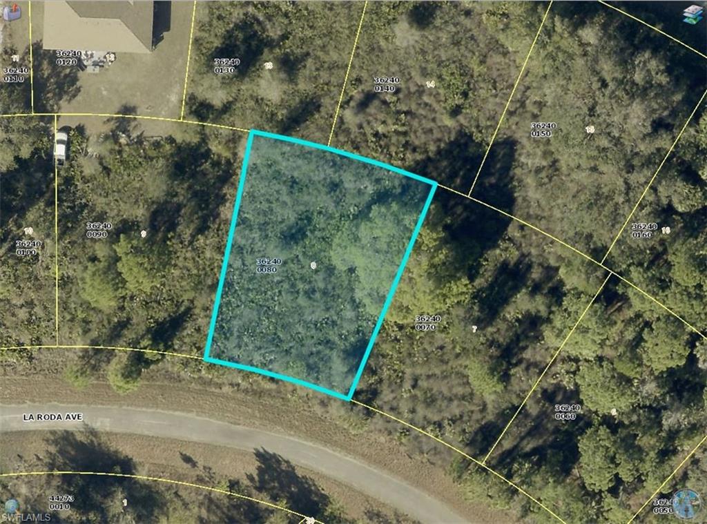 Approximately 0.26-acre vacant residential lot in the Greenbriar area of Lehigh Acres. Located on La Roda Avenue, this parcel offers a wooded setting and paved road frontage. Lee County Property Appraiser records show RS-1 zoning.