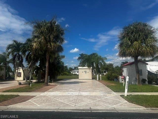 Enjoy your own piece of paradise in beautiful Silver Lakes RV & Golf Resort! This attractive RV site offers dual hookups, providing added flexibility for your RV setup. The property features decorative pavers along both sides of the site and a large painted extended pad at the rear, offering additional outdoor living space perfect for relaxing or entertaining.

A 6' x 10' storage shed is equipped with plumbing and electrical connections for a washer and dryer, along with an oversized door that allows for convenient golf cart storage.

One of the standout features of this property is the large, open grassy area directly behind the site, providing a wonderful sense of space and a great place for your four-legged friends to run and play! Beautiful trees offer additional shade, creating a peaceful and inviting outdoor setting.

Whether you're looking for a seasonal getaway or your own piece of Southwest Florida paradise, this property offers a wonderful combination of convenience, outdoor living space, and a desirable location.