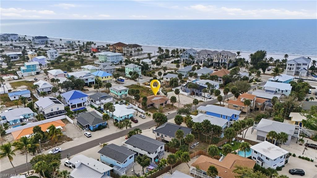 WEEKLY RENTAL ZONED – Prime Fort Myers Beach Investment Opportunity! Don’t miss this rare opportunity to own a highly desirable, oversized lot measuring approximately 90’ x 100’, perfectly positioned just a short stroll to the beautiful white-sand beaches of Fort Myers Beach. This exceptional property offers endless potential for those looking to build their dream coastal home or capitalize on a lucrative short-term rental investment in one of the area’s most sought-after locations. Located near the vibrant Margaritaville Resort, this property provides effortless access to Fort Myers Beach’s top restaurants, bars, entertainment venues, and shopping, including Publix for everyday convenience. The weekly rental zoning, combined with its proximity to the beach, makes this an ideal high-demand vacation rental destination with strong income-producing potential. Whether you’re an investor seeking a prime short-term rental property or a buyer ready to create a custom beach retreat, this property offers unmatched flexibility and opportunity. Enjoy the best of the Florida lifestyle—endless sunsets, warm Gulf breezes, white-sand beaches, and a lively island atmosphere—all just steps from your door. Builder introductions available.
