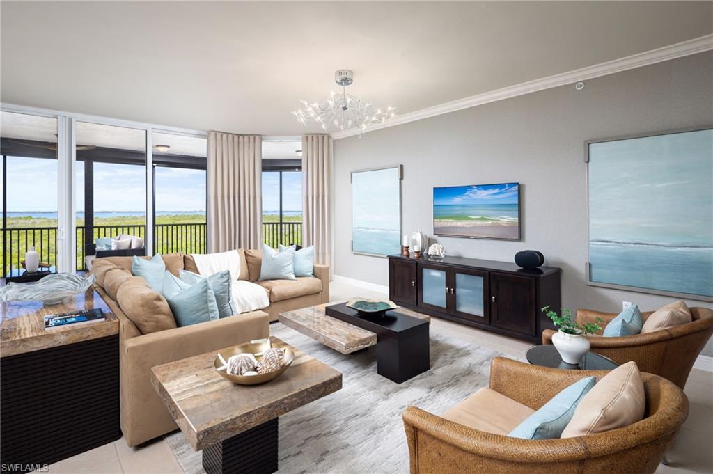 Discover an extraordinary retreat in Castella at The Colony, with the extensive high-end renovations, sweeping views, and an exceptional Southwest Florida lifestyle come together. You are going to love your newly renovated home! This spacious 3-bedroom, 2.5-bathroom residence encompasses 2,372 square feet of beautifully updated living space, capturing views of Estero Bay, the protected natural preserves, and Lover’s Key, with spectacular sunsets providing a stunning backdrop to everyday living.

Meticulously renovated with an emphasis on quality, sophistication, and modern comfort, this exceptional residence showcases an impressive collection of high-end upgrades throughout as it was renovated with the intention of living there as their permanent home. The completely reimagined gourmet kitchen features updated cabinetry, elegant countertops, a stylish backsplash, center island, breakfast bar, and premium stainless steel appliances, including a new refrigerator, cooktop, oven, and Sub-Zero wine cooler. Additional enhancements include new designer lighting fixtures, updated plumbing fixtures, custom designed window treatments, custom-designed closets, and a new washer and dryer. Every detail has been thoughtfully considered to create an inviting atmosphere of timeless elegance.

Electric hurricane shutters offer added convenience and protection, while a newly installed premium Daikin air conditioning system with a warranty provides additional comfort and peace of mind.

The spacious owner’s suite serves as a private sanctuary, featuring direct lanai access, a luxurious spa-inspired bathroom, and an exceptionally generous custom closet. From the beautifully renovated interiors to Castella’s distinctive open-air atrium entrance, this residence offers an appealing combination of contemporary luxury and peaceful coastal living.

Nestled among 11 acres of lush tropical landscaping, Castella offers a secluded resort-style environment with a sparkling pool and spa, fitness amenities, and beautifully maintained surroundings. Beyond the residence, The Colony lifestyle is equally impressive. Enjoy waterfront dining at the exclusive Bay Club, along with access to Pelican Landing’s remarkable collection of amenities, including a private beach island reached by boat shuttle, tennis, pickleball, bocce, sailing, kayaking, and fitness facilities.

Ideally positioned near Bonita Beach, Coconut Point, Naples, and Southwest Florida International Airport, this remarkable residence offers an exceptional combination of luxury renovations, panoramic coastal scenery, outstanding community amenities, and the convenience of condominium living. Whether entertaining guests, enjoying a quiet sunset, or embracing the best of Southwest Florida, this is a place where every day feels like a getaway.