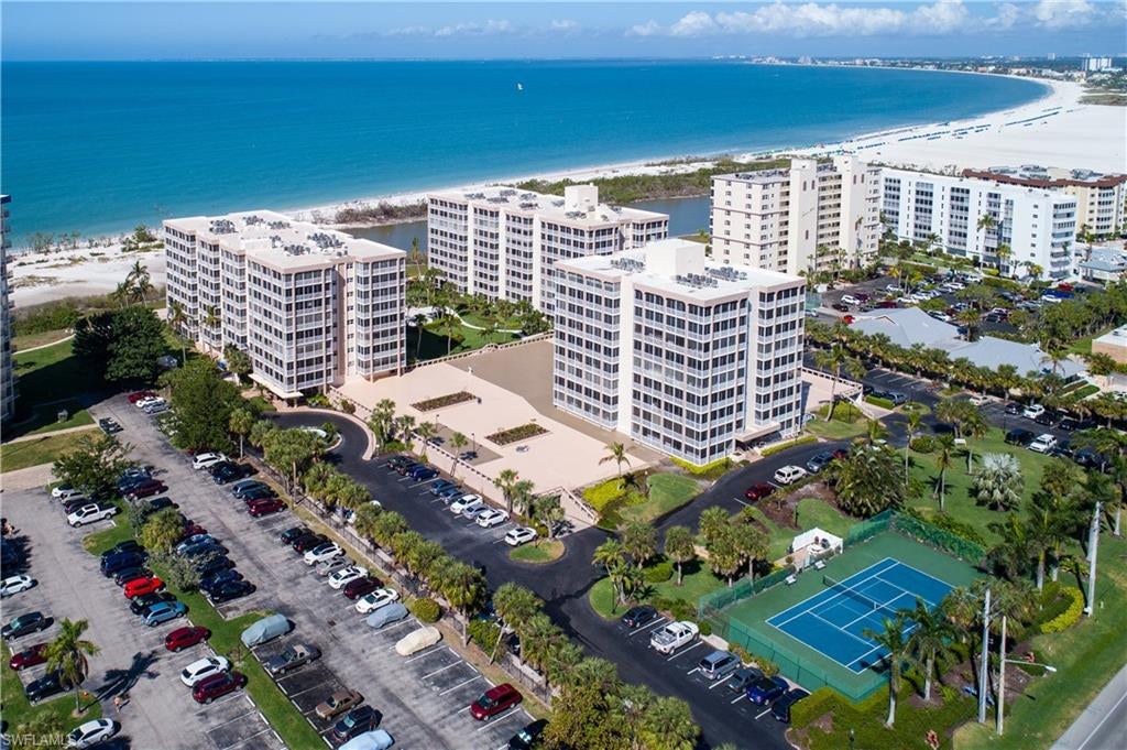 SPACIOUS 1 bed/1 bath beachfront condo on the 8th floor!!!  The best thing about this beach condo is the OVER SIZED LANAI with a sunny, southern rear exposure! It’s this generous lanai space that sets this condo above the rest! It accommodates a large dining table as well as lounge chairs to enjoy looking out onto the gorgeous turquoise waters of the Gulf of Mexico.  Inside, the large kitchen has ample cabinet storage and room for an eat in breakfast nook.  New flooring was put in throughout!! The laundry room accommodates a full sized washer and dryer. 
Walk directly across the street to shops and restaurants at Santini Plaza and don't forget the market on Tuesday and Thursday mornings there also!  Fish Tale Marina, Lovers Key State Park, and a movie theater are all close by!