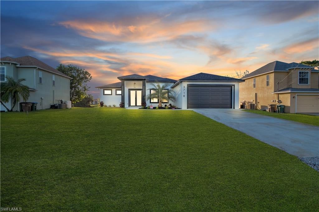 Discover your next home in Cape Coral! This beautiful new construction features 3 bedrooms, 2.5 bathrooms, and canal views. With 1,702 sq ft of living area, it offers a functional layout, a spacious great room, a modern kitchen, a dining area, and a private primary suite with a walk-in closet. Enjoy the outdoor kitchen and lanai, perfect for relaxing and entertaining outdoors, along with the convenience of a 2-car garage. A wonderful opportunity to enjoy the comfort and style of a brand-new home!