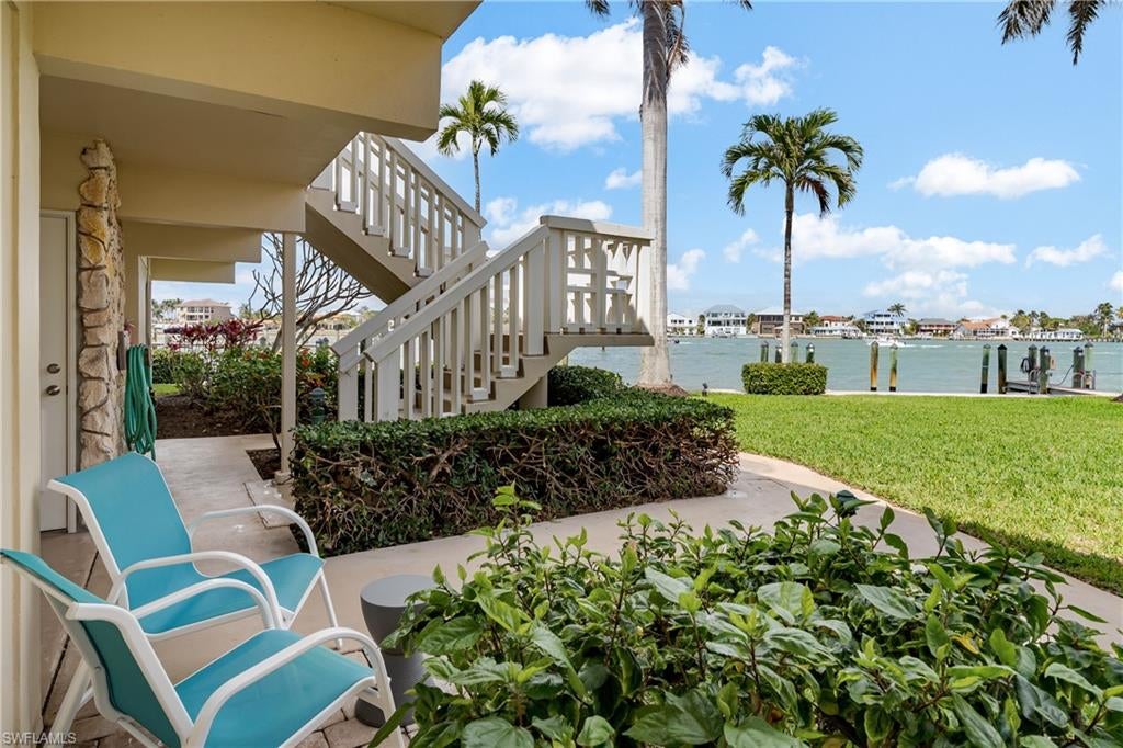 Discover a rare opportunity in Ville de Marco East—an inviting, beautifully maintained two-bedroom, two-bath residence that truly stands out. This spacious, light-filled condo offers an expansive layout ideal for hosting family and friends. Porcelain tile flooring flows seamlessly throughout, creating a clean and elegant look. With two living rooms, there's ample space for relaxation, entertainment, or simply enjoying a bit of quiet time. Custom cabinetry provides exceptional storage, while wood plantation shutters and impact-resistant windows add timeless style and practical peace of mind. The bedrooms feature custom built-in closets designed for effortless organization. Updated bathrooms, a pull-out kitchen pantry, granite countertops, and a full-size washer and dryer enhance both beauty and everyday convenience. The outdoor patio—perfectly positioned with ideal southern exposure—invites you to enjoy warm, sunlit days year-round. Just steps from your door, take in serene water views, watch dolphins glide by, or cast a line from the community's private pier. If boating is part of your lifestyle, boat slips are available for lease. Ville de Marco East is a friendly, active community offering casual gatherings and planned events throughout the year. Nestled in the desirable Old Marco area, you're close to local restaurants, shops, and entertainment—no car needed. A wonderful blend of comfort, location, and coastal charm, this residence is ready to welcome you home.