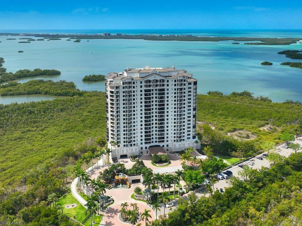 This fully furnished, move-in ready La Scala residence offers refined coastal living. Professionally custom designed home with attention to detail, resulting in an elegant living experience. Positioned on the 10th floor, sweeping southwestern exposures capture breathtaking unobstructed panoramic views of the Gulf and Bay. Spanning over 3,500 square feet, marble and wide-plank wood flooring, layered LED lighting, custom builtins seamlessly integrate storage, media, and refrigeration, while the striking white chef’s kitchen features premium Sub-Zero and Wolf
appliances, quartz countertops, and refined finishes throughout. Expansive living spaces are framed by nearly 10-foot ceilings, including three spacious en-suite bedrooms and a versatile den. The state-of-the-art fitness center with sauna and tranquil resort-style pool and spa are for the privacy of 64 residences, ensuring a truly boutique experience. A staffed front desk provides 24-hour security and service. Residents of La Scala
enjoy an exclusive lifestyle with two levels of refined amenities, including an elegant two-story social salon, billiards room, boardroom, private theater, and library. Ownership also includes access to the coveted Colony lifestyle, featuring waterfront dining at the Bay Club, a private island beach park, and optional membership at the prestigious Colony Golf Club.