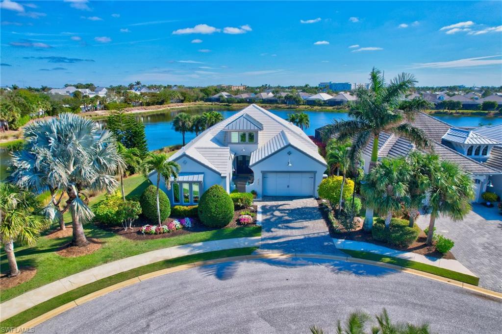 Rarely available, this meticulously maintained Jasmine Grande residence captures expansive private water views from nearly every room. Offering two spacious bedrooms, an office/den, a versatile flex room with wet bar, and 2.5 baths, the home blends everyday comfort with refined living.

The impressive great room showcases 14-foot double tray ceilings, crown molding, and abundant natural light—an ideal backdrop for stylish entertaining. Seamlessly connected, the gourmet kitchen is a chef’s delight, featuring stainless steel appliances, granite countertops, and an oversized island with seating for four.

A true showpiece, the Eastern-facing screened lanai is designed for relaxation and entertaining alike. Enjoy the sparkling pool, fully equipped outdoor kitchen with grill, and multiple seating areas—all while taking in tranquil water views. Set at the end of a quiet cul-de-sac with water wrapping two sides, the property offers unmatched privacy.

Notable upgrades include 10-foot pocketing impact sliders, hurricane screens on the lanai, rich wood and tile flooring, and even an insulated garage door for year-round comfort.

Beyond the home, the Isles of Collier Preserve spans 2,400 acres of pristine lakes and nature preserves, offering endless opportunities for recreation. Residents enjoy scenic walking and biking trails, kayaking, paddleboarding, tennis, pickleball, bocce, and a dog park. The community clubhouse features a state-of-the-art fitness center, resort and lap pools, and the inviting Overlook Bar & Grill.

Perfectly located just minutes from Old Naples’ shops, dining, and beaches, and moments from the Naples Botanical Garden and acclaimed Naples Pickleball Center, this home offers the ideal blend of luxury, privacy, and vibrant community living.