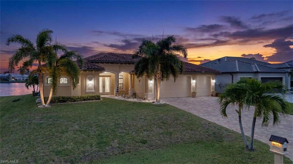 This is the kind of waterfront setting that’s hard to find in Cape Coral. No-bridge Gulf access, an incredible expanse of water and long, open views toward the North Spreader and preserve give this home a setting that immediately stands out. It feels open and private, with water and natural Florida landscape as the backdrop from nearly every angle.  The home offers 3 bedrooms plus a versatile den, 2.5 baths, and two spacious living areas. The main living room is open to the kitchen, which features granite countertops and stainless steel appliances, while the large family room across the back of the home takes full advantage of the incredible water views. Tile flooring throughout keeps everything easy and practical for Florida living. Outside, the negative-edge heated pool overlooks the water through a picture-window screen, creating an almost uninterrupted view from the lanai. Pavers surround the pool, and a convenient pool bath makes the outdoor space more functional for entertaining or spending the day by the water. An outdoor kitchen makes entertaining even easier with a built-in grill and refrigerator. Boaters will appreciate the composite dock with captain's walk, 10,000-lb boat lift, and 4,000-lb Jet Ski lift. A gorgeous pavered expanse runs the length of the seawall - perfect for lounging, fishing, and evening fires at the water's edge. A 3-car garage with epoxy-finished floor provides plenty of room for vehicles, storage, and all the extras, while the large paver driveway adds even more space. Whether you're heading out on the boat, relaxing in the pool, or enjoying the wide-water views from the family room, this home is designed to make the most of its exceptional waterfront setting. NW Cape Coral is the hottest area of growth in the Cape — private, upscale, with quick access to restaurants and shopping. If wide-water views and Gulf access are on your list, this one is worth seeing in person.