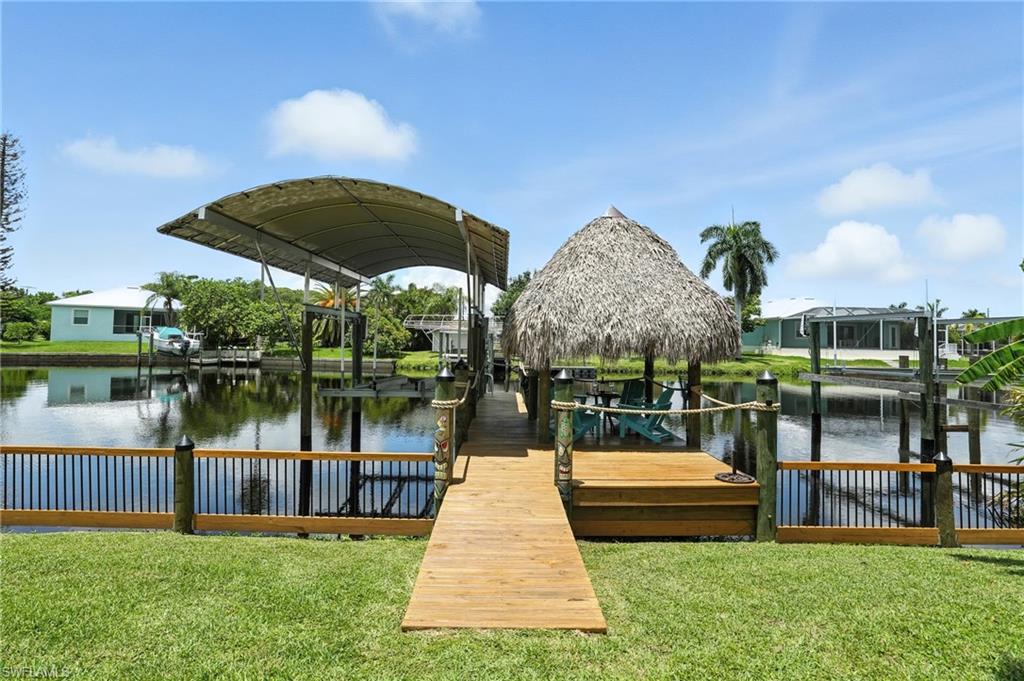** This home can be purchased with NO INCOME verification needed! ** Where can you get a DIRECT GULF ACCESS home with NO BRIDGES for this price???!!! This WATERFRONT Gem in Fort Myers is a TRUE Boater’s Paradise! WITH DIRECT GULF ACCESS and Located just SECONDS from the Famous Boathouse Tiki Bar & Grill, this home offers the perfect blend of LUXURY & LOCATION. With a Beautiful FULL RENOVATION complete in 2024, including a Brand-New Kitchen featuring Stunning Granite Countertops, 42” Cabinets, a Gorgeous Backsplash, and top of the line Appliances, this home is Move-in Ready. The Updates don't stop there—New Hurricane Windows and Doors throughout, New Travertine Flooring thru-out, New Bathrooms, a New Roof and Gutters (2023), New 200 amp Electric box, and Fresh Interior & Exterior Paint make this property feel like NEW! You can also use this waterfront home for an AirBnB short term rental OR a long term rental, if you prefer with NO COMMUNITY RESTRICTIONS whatsoever! With NO HOA this home makes sense for AirBnB numbers!! You can also add a pool if you'd like because there is space AND it's on city water & sewer!! Enjoy the LOW Property Taxes as well!!! Step outside and you'll find your own Private Dock with a 7,000 lb Boat Lift with a Canopy Cover along with Water & Electric PLUS a TIKI HUT with Electric and a Ceiling fan—perfect for Relaxing by the Water while you sip your morning coffee or evening cocktail. The New Irrigation system ensures your outdoor space stays lush and vibrant. Enjoy the Western Sunset Views with AMAZING SUNSETS!! With direct access to the GULF and MINUTES to downtown Fort Myers River District & I-75, this location offers unbeatable convenience to everything you need—whether it's a day on the boat or a night out in the city. Make your appt today to check out this beauty! YOU DESERVE this lifestyle!!!