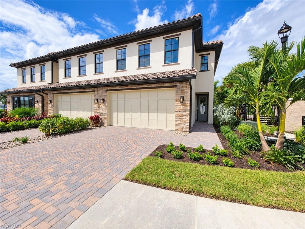 Discover effortless Florida living in this move-in-ready corner-unit townhome located in the heart of Estero. Ideally positioned at the front of the community, this exceptional home is just steps from the community amenity center and moments from Coconut Point, the new High 5 entertainment center, premier shopping and dining, and a short drive to Southwest Florida’s beautiful Gulf beaches. Inside, the gourmet kitchen showcases stacked upper cabinetry, beautiful quartz countertops, stainless steel appliances, and an open layout designed for both everyday living and entertaining. A rare and versatile floor plan features two spacious primary bedroom suites—one conveniently located on each level—complete with expansive walk-in closets and spa-inspired bathrooms featuring oversized showers. Upstairs, two additional guest bedrooms provide plenty of space for family, visitors, a home office, or flex space. Outside, enjoy year-round Florida living on the expansive covered lanai with a screen enclosure and desirable western rear exposure, perfect for taking in beautiful evening sunsets. Thoughtfully designed as a desirable corner-unit residence, this home offers added peace of mind with impact-resistant windows and doors, construction built to current building codes, an included builder warranty, and a Flood Zone X location—all complemented by the convenience of a low-maintenance, lock-and-leave lifestyle. Ask our sales consultants about exclusive interest rate buydown opportunities! Please see MLS supplements for floor plan layout/interior design selections. Home Site 120
