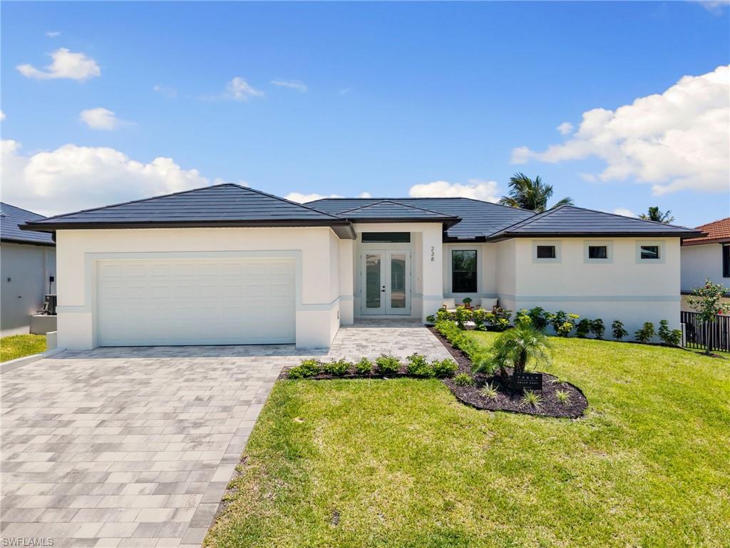 This 2025 new construction 4 bedroom waterfront home offers it all including: perfect Collier County location in Little Hickory Shores on a wide canal, walk or bike to beautiful Barefoot Beach, premier boating out your back door via a new dock and lift with no bridges and quick gulf access, southern exposure, light coastal design inside and out, open floor plan and designer selections throughout, but best of all is PEACE OF MIND with a Tesla roof and battery pack so no generator or propane tanks and lines to worry about and no electric outages, concrete construction to the latest hurricane codes including impact windows and doors and the whole house including the garage and pool were constructed at an elevation above FEMA requirements so flooding is not an issue all while constructed on one level for ease of living. Features include great room, kitchen and dining all open to covered lanai leading to the swimming pool and deck area all overlooking the water and boat dock, volume & vaulted ceilings, large kitchen with island, pantry, quartz countertops custom double stacked Kitchen cabinetry, porcelain wood plank flooring, 8’ doors, smooth drywall finish and designer bath selections. The elevated pool with sundeck includes an oversized covered patio with access to a convenient pool bath. The spacious master suite offers 2 walk in closets with built-ins, oversized frameless shower and floating tub with dual vanities and the 3 guest rooms include an additional en-suite bath. The oversized garage also above flood is finished with epoxy flooring. Little Hickory Shores is centrally located to dining, entertainment, golfing, arenas in Naples and Bonita Springs and is close RSW Airport, the Promenade, Coconut Point, Mercato & Waterside Shops and Old Naples. There is also an option to join the Club at Barefoot Beach which offers casual and fine dining restaurants, pool & beachside food, drinks and chair service, indoor & outdoor bars, tennis courts with pro & a full events calendar. (waitlist with usage during wait period). Note: This property is a perfect full time homestead residence or winter home residence with no worries while away during the summer, a come and go property that earns enough to carry itself when you are not in residence or a full time rental property since no rental restrictions and no HOA fees. Designer turnkey furniture and furnishings package can be purchased for $99,900
