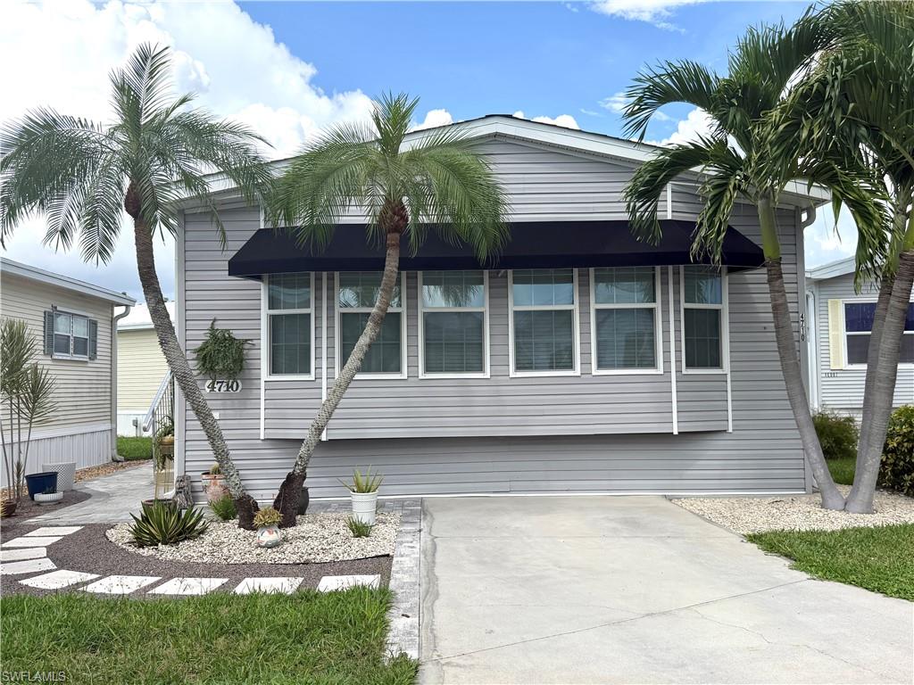 Discover the perfect blend of comfort and active living in this stunning 2018 Chariot two-bedroom, two-bath mobile home, situated in the highly sought-after Riverwoods Plantation. In this premier 55+ community, you enjoy the rare benefit of owning your land, providing both security and peace of mind.

Step inside to find a beautifully maintained, open-concept floor plan designed for effortless living. The home boasts ample storage space and an abundance of cabinetry throughout, ensuring everything has its place. Both bathrooms feature modern walk-in showers for added convenience and accessibility. Outside, you can relax on your private patio surrounded by lush landscaping and swaying palm trees, with stylish awnings on the front of the home adding to its charming cottage appeal. This home truly must be seen in person to appreciate its beauty and thoughtful design.

Life at Riverwoods Plantation is defined by its vibrant, year-round social scene. With a full-time Activity Director and an on-site manager, there is never a dull moment. Residents enjoy an extensive array of amenities, including:

*   Sports & Recreation: Pickleball, tennis, shuffleboard, bocce, horseshoes, billiards, and both sand and water volleyball.
*   Social Life: A full calendar of dances, special dinners, and community clubs.
*   Waterfront Access: Exclusive riverfront property on the Estero River featuring boat storage, a private boat ramp, and a dedicated launch area for kayaks and canoes.

The Estero River offers a scenic path leading directly into Estero Bay and the Gulf of Mexico, making it a paradise for boating and water sports enthusiasts. Centrally located, the community provides easy access to Fort Myers, Fort Myers Beach, Sanibel, and the region's finest shopping, dining, and the RSW airport. 

Experience a lifestyle where you can be as active as you choose in a community that feels like a permanent vacation.