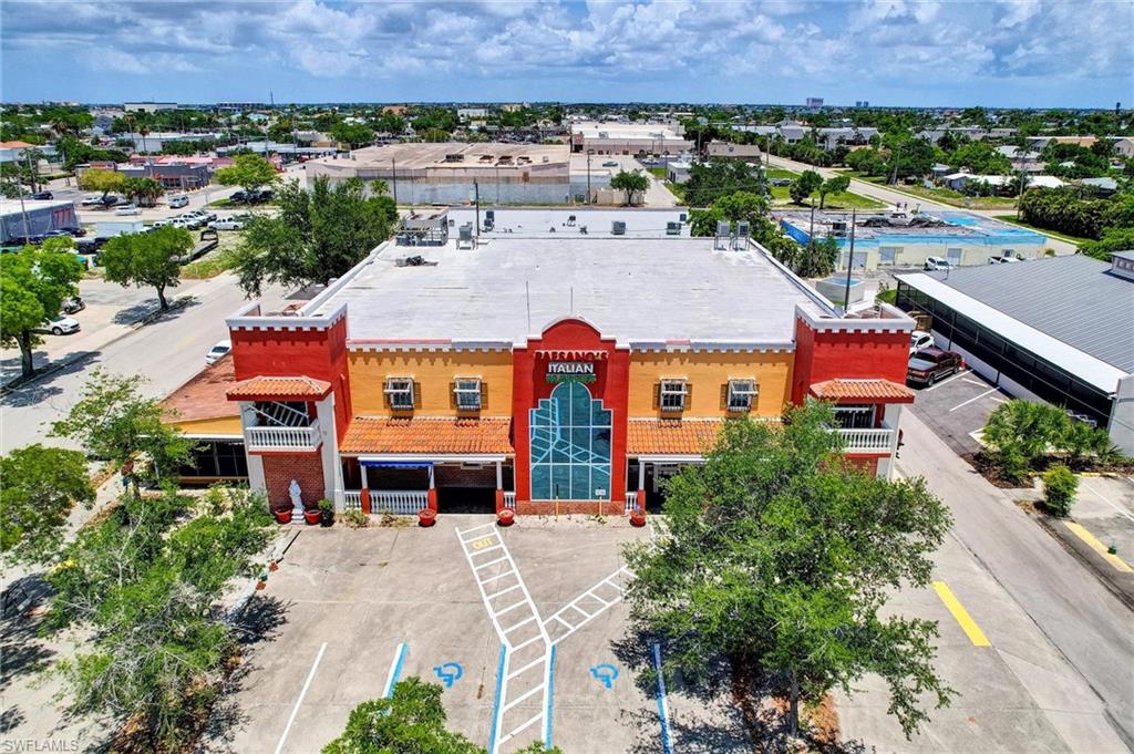SELLERS READY TO MEET MARKET PRICE. DOWNTOWN CAPE CORAL! Fantastic opportunity for a business to make this solid building of over 17,500 sq ft a great operation.  This building thrived as Paesano's for over 30 years, owners are ready for their next chapter.  This 2 story property is within the highly beneficial (SC) South Cape Zoning District, the C.R.A and The South Cape Hospitality & Entertainment Area.  This listing includes both 862 Lafayette St. (the building and some parking) and for an additional off-street entrance from the south and parking, 859 Miramar St.  Located 1 block south of Cape Coral Parkway and 1 block east of Coronado Parkway. The building has 6 walk-in in coolers and 3 walk-in freezers, 2 commercial kitchens and a butcher room and phase-3 power.  A great deal of FFE are on premise for consideration of sale.  Multiple restrooms.  The 2nd floor office has a small balcony overlooking main shopping area floor that has the soaring ceiling.  The "patio seating" has one of the kitchen setup.  It is a large screened area with power shutters.
Use your imagination...this location could be profitable with a number of different businesses because of the square footage, location and parking.  Key* The New Apartment Complexes One Block Away, "The Cove On 47th" On Cape Coral Parkway Has 327 Units And "Madison Square" On Miramar Has 82 Units - OVER 400 NEW UNITS!
Also, 2 other big projects about to begin which will bring additional positive impact to this location, the CRA Project, Bimini Basin East and a private project Bimini Square which offers 218 additional upscale apartments and a 500-space parking garage all within easy walking distance.