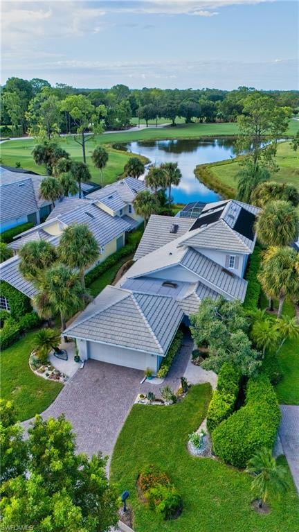 Beautiful long lake and golf course view. We are proud to feature this renovated, spacious 3 bedrooms, 3 bath home which features nearly 3000 square feet of under air conditioning living space! Located on the 6th hole of the Wyndemere Gold Course. The lanai features a swimming pool and spa with spectacular views. As you walk through the entrance of the home, you will immediately notice the contemporary feel highlighted by white oak wood flooring. Three skylights bring a warmth to the great room and a well placed center island features a wine refrigerator. The primary suite includes sliding doors to the lanai, walk-in closet and recently refurbished bath area. The second floor offers a second primary suite, approximately the same size as the primary suite, along with a renovated bath area with both a shower and a separate free standing tub. The third bedroom/den also includes its own au-suit. An oversized kitchen features stainless steel appliances and ample counter space. Wyndemere Country Club has been awarded the Platinum Club statis and is conveniently located minutes to the beach and downtown Olde Naples. Wyndemere offers a 27-hole golf course which was designed by Arthur Hills, 10 Har Tru tennis courts, 7 pickleball courts, bocce, croquet, fitness center and restaurants.