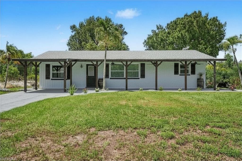 Welcome to an exceptional opportunity offering THREE LIVING SPACES completely renovated, upgraded, and updated on one spacious property! The main residence features 3 bedrooms, 2 bathrooms, and approximately 1,800 square feet of thoughtfully updated space, PLUS an attached EFFICIENCY apartment and a DETACHED 2-bedroom, 1-bath Guest House - Additional Dwelling Unit (ADU), creating endless possibilities for multi-generational living, guest accommodations, rental income, or a private home office. The main home has been extensively renovated from top to bottom with updated electrical, plumbing, spray foam insulation, Argon gas windows, architectural shingle roof, central air conditioning with Wi-Fi thermostat, on-demand water heater, luxury water-resistant vinyl flooring, custom trim, six-panel doors, recessed lighting, Wi-Fi controlled ceiling fans, and fresh interior paint throughout. The stunning kitchen showcases custom cabinetry with Lazy Susan storage, custom tile backsplash, stainless steel appliances, under-cabinet microwave, and flexible faucet. The spacious living room is highlighted by a custom tongue-and-groove ceiling, built-in entertainment wall, and electric fireplace with customizable Wi-Fi lighting and heat settings. The attached efficiency apartment offers approximately 484 gross square feet (not included in the county heated living area) and is privately separated from the main home with locking French doors while maintaining its own exterior entrance. Complete with a full kitchen, full bathroom, washer/dryer combo, mini-split HVAC system, ceramic tile flooring, custom finishes, and private living space, it's ideal for guests or rental income. Also located on the property is a detached 588 -square-foot ADU (not included in the county heated living area) featuring 2 bedrooms, 1 bathroom, a full kitchen with new cabinetry and appliances, stacked washer/dryer, mini-split air conditioning, updated bathroom, ceramic tile flooring, French doors, and covered front porch. Outside, you'll find room for all your toys with ample parking for boats, RVs, trailers, and work vehicles. Two separate RV/camper hookups include electric and septic connections. Relax beneath mature oak trees or enjoy fresh fruit from the producing mango tree. Enjoy watching your 2 lemon trees mature and come to fruition. The extended front porch with three ceiling fans creates the perfect place to unwind. Located less than a half mile from a public boat and kayak launch and just minutes from pickleball, tennis courts, restaurants, shopping, and entertainment, this unique smart-home property offers incredible flexibility for homeowners and investors alike. Live in one residence while generating rental income from the others, accommodate extended family, or create the ultimate private compound.   Plus, Offering a 1 year home warranty! An extraordinary offering like this is truly one of a kind!