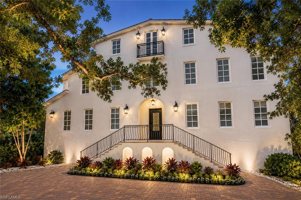 One or more photo(s) has been virtually staged, AI generated or rendered.  Price significantly reduced and now priced to sell. Offering nearly 6,000 square feet of luxurious living space, this exceptional Olde Naples residence features 6 bedrooms, 4.5 bathrooms, a private den, library, and an impressive third-floor bonus room ideal for entertaining, a media room, game room, or private retreat.

Designed for both everyday living and grand-scale entertaining, the gourmet kitchen is a chef's dream, appointed with Sub-Zero and Wolf appliances, dual dishwashers, and an oversized walk in pantry. A dramatic two story foyer, illuminated by an imported chandelier, welcomes you inside and leads to an elegant second floor mezzanine, complemented by a grand staircase and solid mahogany doors throughout.

The private backyard oasis features a heated saltwater pool with a tranquil water feature, surrounded by lush tropical landscaping and mature trees for exceptional privacy. From the expansive third floor terrace, enjoy spectacular bird's eye views while watching the City of Naples Fourth of July fireworks, an unforgettable experience from the comfort of your own home.

Perfectly positioned in the heart of Olde Naples, this fully remodeled residence is just a short walk to world-class beaches, renowned dining, boutique shopping, and boating. Additional highlights include garage ceiling height designed to accommodate a future vehicle lift, plus multiple flexible living spaces including an exercise room, family room, media room, and bonus room to suit a variety of lifestyles.

This is an exceptional opportunity to own one of Olde Naples' largest and most versatile homes at an outstanding value. Combining remarkable size, luxury finishes, and an unbeatable location, this move-in-ready residence is priced to attract immediate interest. Don't miss this rare opportunity, A must see!