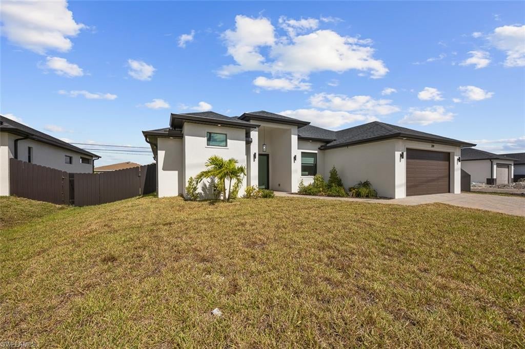 Welcome to 209 Kismet Parkway E, a brand-new 2025 construction home in North Cape Coral, Florida, offering modern design, energy efficiency, and no HOA restrictions. This move-in-ready single-family home for sale in Cape Coral is ideal for buyers seeking quality craftsmanship, flexible living space, and long-term value in Southwest Florida.

Featuring 1,818 square feet of open-concept living, this home showcases tray ceilings, tile flooring throughout, and impact-resistant windows and doors, providing enhanced storm protection and energy efficiency. The thoughtfully designed layout includes three bedrooms, three full bathrooms, and a private den, perfect for a home office, gym, or guest suite, highly desirable features for today’s buyers.

The modern kitchen is designed for both functionality and entertaining, complete with stainless steel appliances, a large center island, and a walk-in pantry. The spacious primary suite offers a spa-inspired bathroom with dual vanities, a walk-in shower, and custom closet cabinetry, creating a true retreat at home.

Step outside to a covered lanai overlooking a fully fenced backyard, ideal for outdoor dining, pets, or the future addition of a pool. Situated on a .23-acre lot, this property also includes a two-car garage, paved driveway, split-bedroom floor plan, and no HOA fees or restrictions, making it perfect for full-time residents, seasonal homeowners, or investors.

Conveniently located near shopping, dining, schools, and major roadways, this North Cape Coral home is just minutes from popular attractions such as Four Mile Cove Ecological Preserve, Cape Coral Farmers Market, and the Cape Coral Historical Museum, offering the perfect balance of privacy and accessibility.

Seller is willing to offer buyer concessions toward closing costs, making this an excellent opportunity to reduce upfront expenses and maximize affordability.

If you’re searching for a new construction home in Cape Coral, no HOA property, or a move-in-ready Florida home with closing cost incentives, 209 Kismet Parkway E checks every box.