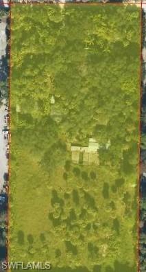 A Rare 5-acre agricultural property offering a unique opportunity for Business Owners, Investors, & Builders! Located off Immokalee Road & Rock Road, this 5-acre agriculturally zone property offers space, existing infrastructure, and exciting possibilities for the right buyer.  Previously home to a local horticulturist who operated a plant nursery, this fully fenced and gated property is ready for someone with a vision to explore it's potential.  Properties features include a barn with (8) horse stalls and existing pastures, well-fed, muti-zone irrigation system, home water-softener system. Existing mobile home is need of TLC, plus additional buildings .Whether you're looking to expand an existing agricultural business, establish a new operation, or explore the possibilities that 5 acres can offer, this property deserves your attention.