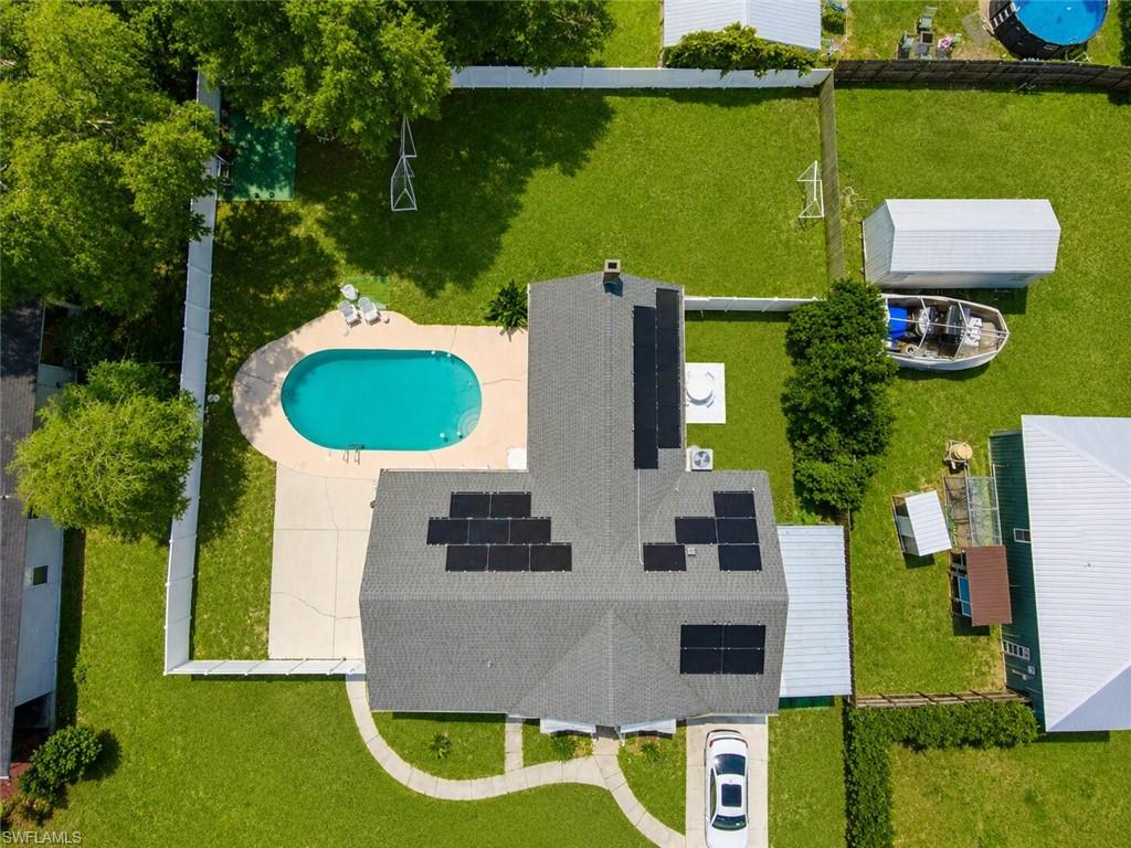 One or more photo(s) has been virtually staged, AI generated or rendered.  One or more photo(s) has been virtually staged, Highlights: Rent cost cover Solar panels cost, Water bill, Lawn care-service and Inground pool care-maintenance. 
Enjoy Florida living in this inviting 3-bedroom + Den, 2-bath home featuring a sparkling private pool, large fenced backyard, and covered parking. Nestled in the charming lake community of Keystone Heights, this property is conveniently located within walking distance to Keystone Beach, parks, and downtown amenities. Residents appreciate the area's peaceful atmosphere, scenic lakes, and easy commute to Gainesville, Jacksonville and the historic St Agustine. With plenty of outdoor space and a prime location, this home offers the perfect combination of comfort and convenience.