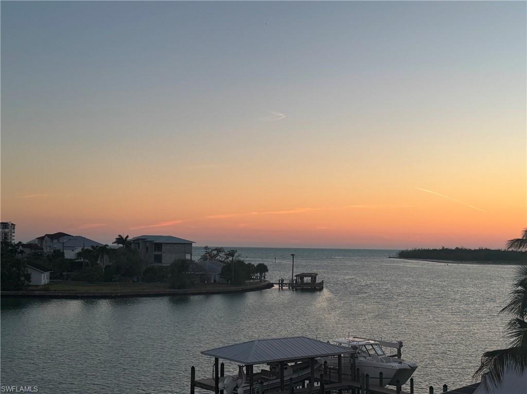 A rare opportunity to build a custom waterfront residence in Isles of Capri awaits. This exceptional southern-exposure homesite captures breathtaking wide-open bay views and offers direct Gulf access from your private boat dock, ideally positioned just moments from Capri Pass and the open waters of the Gulf of Mexico. A notable improvement already in place, the seawall has been elevated 48 inches above the previous site elevation and designed to meet current Collier County floodplain standards. Life here is defined by sunset cruises, dolphin sightings, and endless backwater and Gulf fishing adventures. Enjoy easy access to popular waterfront destinations, including the iconic Snook Inn on nearby Marco Island, just a scenic boat ride away. Tucked between Naples and Marco Island, Isles of Capri has intentionally preserved its authentic Old Florida charm, offering a tranquil waterfront lifestyle free from major retail chains, strip malls, and corporate restaurants. Defined by locally owned marinas, beloved waterfront eateries, and a genuine sense of community, the island is a true boater's paradise that feels worlds away while remaining only minutes from the conveniences, dining, and attractions of Naples and Marco Island. Enjoy the charm of the Isles of Capri today while benefiting from the island's ongoing marina redevelopment, bringing enhanced boating facilities, modern amenities, and additional investment appeal to this sought-after waterfront community.