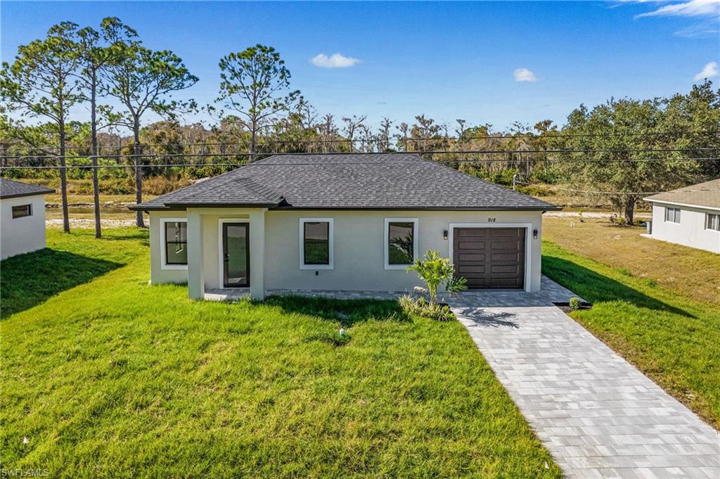 Brand-New Construction**MOVE IN READY NEW DREAM HOME**Seller willing to offer up to $6,000 toward buyer's closing costs** Be the 1st to live in this Gorgeous 3 Bedroom, 2 Bath Home with Garage, on a Spacious canal front lot.**Oversized modern tile flooring throughout every room complimented by Impact-Rated Windows that let you enjoy the wonderful Florida Sunshine! The gorgeous Kitchen has Custom cabinetry, Quartz countertops, & stainless-steel appliances. Spacious LUXE Bathrooms feature beautiful cabinetry, roomy showers like a Spa! This HOME sits on a rare Quarter-Acre lot & offers Great Outdoor Space to use how you like***A Great Location & neighborhood to enjoy, with NO HOA/Homeowners Association! **Your NEW FLORIDA HOME just one call away...**