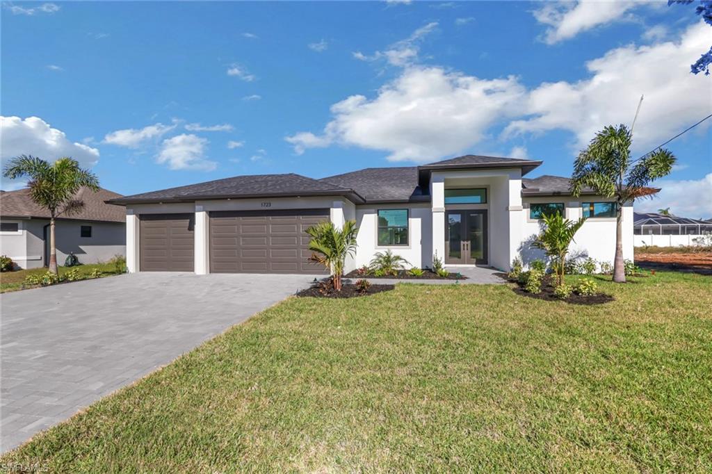 Discover the elegance of the "Signus Signature" model, a modern 3-bedroom + den, 2-bath masterpiece with a spacious 3-car garage, POOL, and a stylish paver driveway. Built for resilience and style, this home boasts PGT hurricane impact windows and doors (no shutters needed!), ensuring safety and peace of mind. Step inside to find 12x24 plank tile flooring throughout the main areas! The open-concept design features tray ceilings, 8 ft interior doors, and premium finishes, including solid wood shaker cabinets with soft-close doors, stainless steel appliances, and sleek quartz countertops throughout. The master suite offers sliders to the lanai, two walk-in closets, and a spa-like bathroom with dual sinks, a spacious shower, and a relaxing soaking tub. Outside, you are welcomed to a 12x24 pool with an 18x45 paver deck, with screen enclosure. Dedicated space pre-wired and pre-plumbed for your future outdoor kitchen. Epoxy-finished garage floor with stylish flakes! Flood Zone X, no flood insurance required. On city water and sewer, low balance of $8,100 remaining on the assessments. MOVE IN READY! Inquire for More Details!