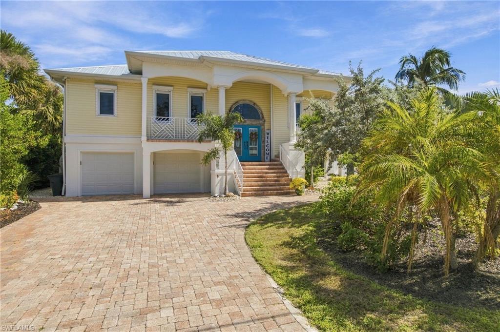 Enjoy lagoon views, a private heated pool, and deeded beach access at 1034 Fish Crow Road. Located in Gulf Shores, this three-bedroom-plus-den, two-bath home offers 2,336 square feet of living space with thoughtful updates throughout.

Volume ceilings, crown molding, and plantation shutters complement the interior, while a separate dining room provides space to gather. The kitchen features an island, breakfast area, and a refrigerator and dishwasher replaced in 2025. The split-bedroom floor plan offers privacy for owners and guests, and the den provides flexible space for work or relaxation. Interior improvements include new paint and flooring in two bedrooms and one bathroom in 2024, along with two new toilets in 2025.

Outside, the pool cage was replaced in 2024 with no-see-um screening, creating a comfortable setting for poolside dining and relaxing overlooking the lagoon. A new pool heater was added in 2025, with landscaping refreshed in 2026. Additional improvements include a new downstairs air-conditioning unit and A/C enclosure in 2025, plus a new water heater in 2026. Impact windows and a two-car garage add to the home’s appeal.

With nearby deeded beach access, shoreline walks, shelling, and sunsets can become part of your everyday routine. Whether you’re seeking a full-time residence or a seasonal retreat, this Gulf Shores home brings together generous living space, recent improvements, and the relaxed Sanibel lifestyle.