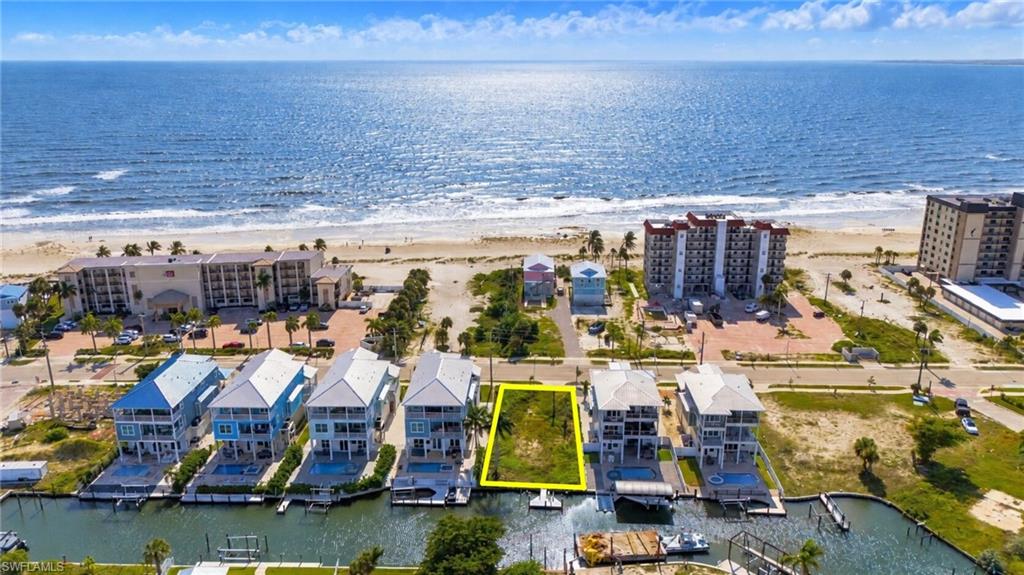 PRIME NORTH END GULF ACCESS HOMESITE – WEEKLY RENTALS PERMITTED! Exceptional opportunity to build your dream coastal retreat or luxury investment property in one of the most desirable locations on Fort Myers Beach! Located at 621 Estero Boulevard, just north of Times Square, this Gulf-access waterfront lot offers the perfect combination of boating, beach access, walkability, and income-producing potential.

Enjoy quick and convenient boating access to Estero Bay and the Gulf of Mexico, with some of Southwest Florida’s most beautiful waterways just minutes away. For beach lovers, public beach access is just a short walk across Estero Boulevard, making it easy to enjoy the white sandy beaches and breathtaking Gulf sunsets.

Situated within walking distance of Times Square, the Fort Myers Beach Pier District, waterfront dining, shopping, entertainment, and the island’s most popular attractions, this location delivers the coastal lifestyle that homeowners and vacationers seek.

WEEKLY RENTALS PERMITTED, offering exceptional flexibility for those looking to build a luxury vacation rental, seasonal getaway, or full-time waterfront residence. The highly sought-after north end of Fort Myers Beach is especially desirable for its convenient access on and off the island, reduced exposure to the heavier traffic farther south, and proximity to the beach and entertainment district.

Estero Boulevard’s north-end Gulf-access properties have historically attracted significant interest from luxury homebuyers and investors, with premier waterfront homes commanding some of the island’s most impressive sale prices.

Whether you’re envisioning a spectacular elevated coastal residence or a high-end vacation rental designed to maximize the property’s location and boating lifestyle, 621 Estero Boulevard presents an outstanding opportunity to invest in the future of Fort Myers Beach!