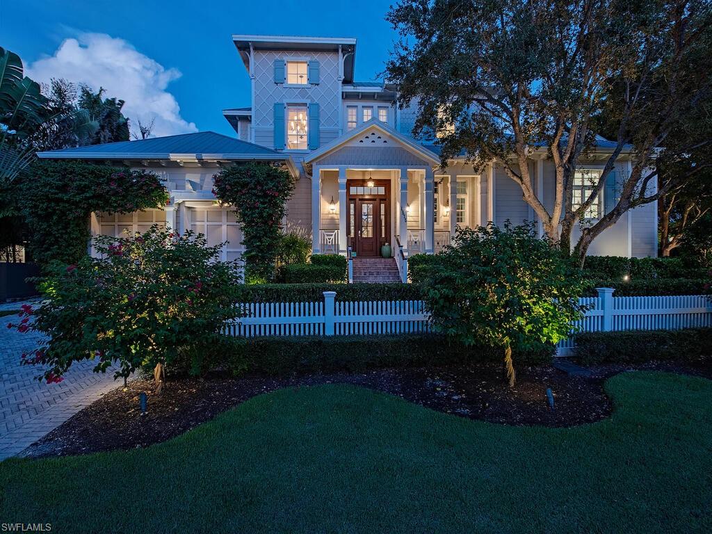Tucked away at one of Naples’ most coveted addresses, this extraordinary coastal retreat blends classic architectural charm and modern luxury with a private beach access just steps away to the Gulf’s shimmering shoreline. Set at the serene southern tip of Gulf Shore Boulevard on a pristine corner lot, this dual-drive bespoke residence offers a lifestyle defined by sun-soaked days, gentle sea breezes, and the effortless rhythm of beachfront living. 

Designed by the esteemed Stofft Cooney Architects, the home is a masterwork of Old Florida style reimagined with a contemporary sensibility. From the moment you enter, warm wood floors, custom finishes, and elegant millwork set a tone of understated sophistication. Light pours in through expansive windows, drawing your gaze toward tranquil garden views and a perfectly positioned southern-exposed pool.
The heart of the home—a chef-inspired kitchen—seamlessly unites form and function with premium Wolf and Sub-Zero appliances, a generous island for casual gatherings, and both a butler’s pantry and wine bar for elevated entertaining.

A series of open, flowing indoor and outdoor spaces create an inviting atmosphere for both intimate relaxation and grand celebrations. Outside, a private courtyard offers a lush tropical escape with a resort-style pool, summer kitchen, gas fireplace, and shaded dining areas designed for year-round enjoyment. Additionally, having a driveway placed on each side of this corner lot home allows for family & guests to maneuver with comfort and ease. 

The owner’s suite is a secluded retreat, complete with His & Hers baths, oversized closets, and a peaceful sitting area that invites morning coffee and quiet reflection. Guest accommodations are equally well-appointed, with a private first-floor suite, two additional ensuite bedrooms upstairs, and a private study that can easily transform into an additional bedroom. A separate guest residence with its own drive and entrance provides comfort and privacy for visitors or extended stays—complete with a spacious bedroom, sitting area, and full bath.

For the car enthusiast or collector, two separate two-car garages—one with a lift system—offer room for up to six vehicles, while a full-house generator ensures uninterrupted comfort and convenience. 

Every detail of this home has been curated to reflect the relaxed luxury of life by the sea. Just a short stroll to the boutiques and restaurants of 3rd Street South, and mere steps from the beach, this is more than a home—it’s your coastal sanctuary in the heart of Naples.
