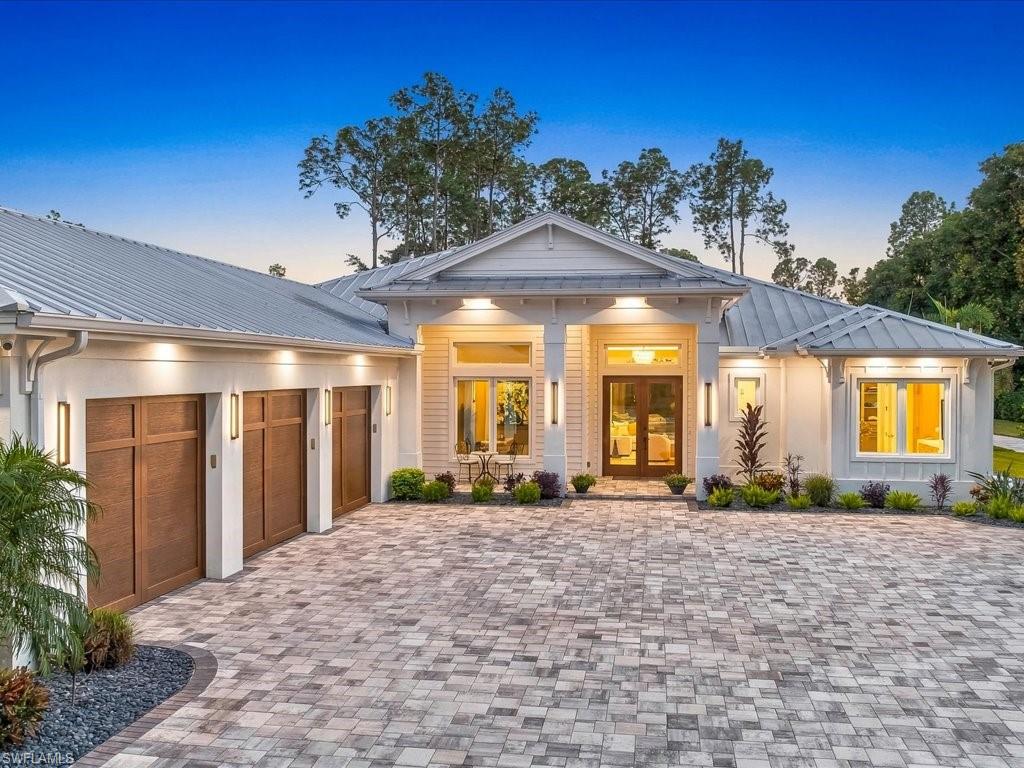 Why settle for luxury with limitations when you can own an extraordinary Naples estate offering complete freedom, exceptional privacy, and uncompromising sophistication? Welcome to 6190 Bur Oaks Lane, where two-point-seven-three acres of beautifully landscaped grounds showcase a remarkable custom residence completed in twenty twenty-four to modern construction standards. With no HOA fees, restrictions, or assessments, this exceptional property delivers the independence and financial advantages discerning buyers increasingly appreciate. Encompassing approximately three thousand nine hundred fifty square feet, this four-bedroom plus den residence features five baths, soaring ceilings, Duchateau European oak flooring, and exquisite architectural details. The stunning gourmet kitchen commands attention with Cristallo Extra Quartzite countertops, bespoke cabinetry, and premium Miele, Monogram, and Sub-Zero appliances, creating an elegant centerpiece for entertaining. The luxurious primary retreat features a spacious sitting area, private lanai access, and a spectacular marble bath with walnut cabinetry, soaking tub, and exquisite Baril shower system. Experience resort-inspired outdoor living with a sparkling pool and spa, fully equipped summer kitchen, inviting fireside lounge, and separate fire-pit patio, all surrounded by the serenity of your private estate. Equally impressive are the property's exceptional ownership benefits. Private well and septic systems eliminate municipal water and sewer charges, while a whole-house generator, reverse-osmosis water system, impact-rated openings, and modern mechanical systems enhance efficiency, independence, and long-term value. A fully permitted, approximately one-thousand-nine-hundred-fifty-square-foot detached steel building, constructed to current building codes, presents virtually endless possibilities for luxury vehicle collections, recreational equipment, hobbies, workshop space, or customized personal pursuits. This extraordinary addition elevates the property's versatility and appeal. A gated entrance, circular paver driveway, and fully fenced acreage complete this remarkable offering. No HOA. No unnecessary restrictions. No compromise. Discover the rare privilege of owning a newly constructed luxury estate where privacy, flexibility, and sophisticated Naples living coexist beautifully. Opportunities offering this combination of acreage, amenities, and ownership freedom are exceptional. Schedule your private showing and experience the distinction firsthand.