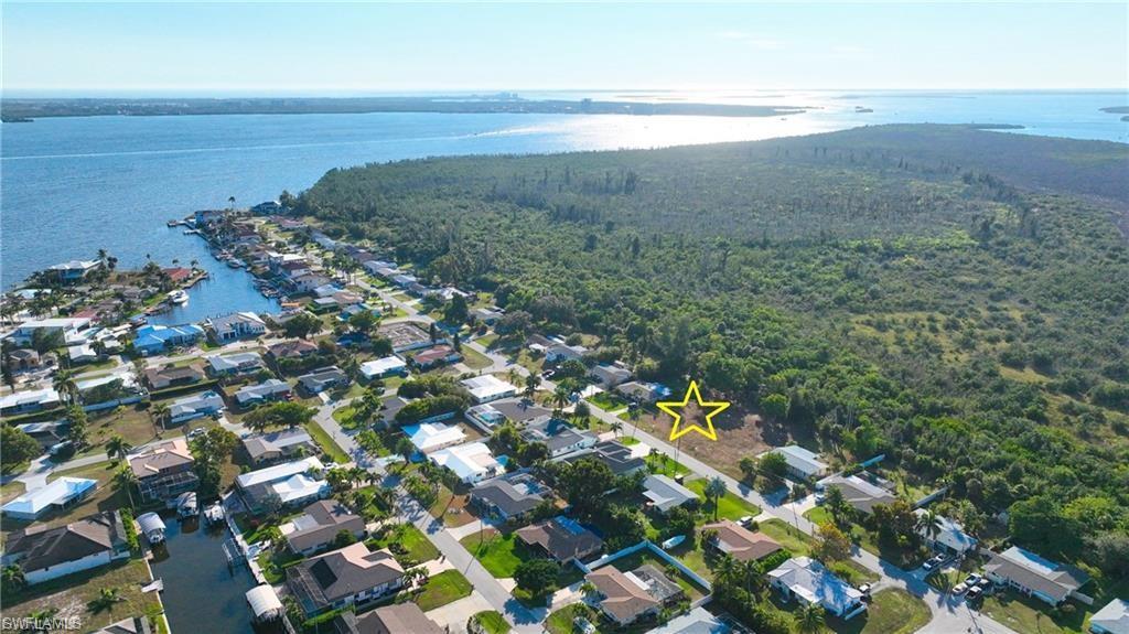 !!! Location Location !!! ALL UTILITIES IN AND PAID FOR.  Build your dream home on this OVERSIZED lot and take advantage of this amazing location, This prime parcel presents an exceptional opportunity to create your dream home, surrounded by the allure of million-dollar waterfront residences. Situated a block from the serene riverfront, this sought-after location is just steps from the Rose Garden area and the prestigious Tarpon Point Marina. THIS GREAT AREA HAS A MARINA,RESORT,SHOPPING AND RESTAURANTS FOR YOUR TOTAL ENJOYMENT. PID #23-45-23-C2-00198.0250
