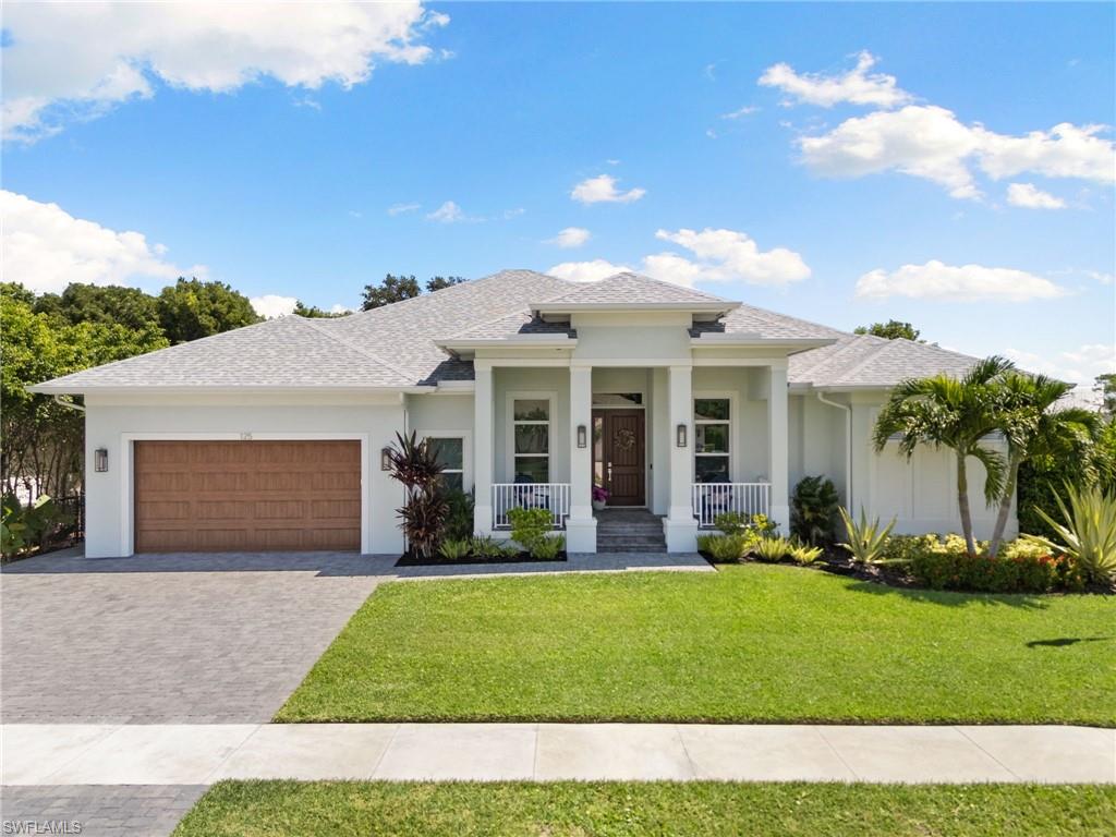 Exceptional craftsmanship and modern elegance define this custom 2021-built residence, including impact windows and doors, situated on a generous, oversized corner lot with an extended paver driveway. Offering 3 bedrooms, 3 bathrooms, a versatile den, and 2,263 square feet of air-conditioned living space, this property presents an outstanding opportunity as a vibrant family home or a lucrative investment property. The large master suite boasts his and hers walk-in closets, dual vanities, and a huge shower. 

At the center of the home is a gourmet kitchen crafted for effortless family gatherings and entertaining, boasting sleek quartz countertops, premium cabinetry, a walk-in pantry, separate laundry room doubling as a butler's pantry, and an open layout that connects seamlessly to the main living areas. Built for high-performance comfort and peace of mind, the residence features full spray foam insulation, whole-home security, and stood strong with no water intrusion from any previous storms. 

The 12-foot oversized 2 ½ car garage is thoughtfully equipped with a new high-lift garage door installation enabling car lifts to be installed, epoxy flooring, overhead storage, an EV charging outlet, a generator hookup, and a battery-backup door opener. Storage continues into the insulated attic via a pull-down staircase. Additional high-end comforts include a central vacuum system, a hot water recirculating pump for instant hot water, and integrated surround sound extending through the living room and lanai. 

Outdoors, your private tropical paradise awaits with a partially fenced yard perfect for kids and pets, complete with a heated saltwater pool powered by Jandy Aqualink smart controls. The expansive deck offers the ultimate setup for soaking up the Florida sun and hosting effortless outdoor hangouts, with abundant space for sun loungers and dining. Ideally positioned for family living in a prime Marco Island location, you are just moments from pristine beaches, Mackle Park, the YMCA, top-rated A+ schools, and a state-of-the-art emergency facility anchored by our dedicated local police officers and fire rescue first responders. Plus, you will love being minutes from an incredible mix of gourmet dining and casual local favorites that capture the best of island living.