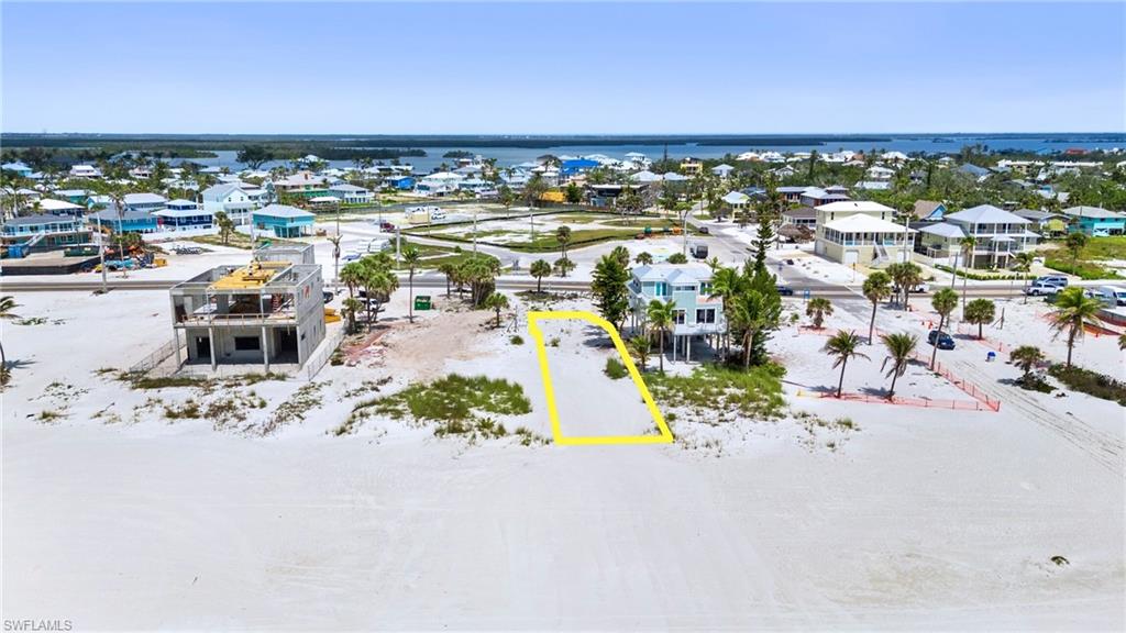 One or more photo(s) has been virtually staged, AI generated or rendered.  Welcome to 5682 Estero Boulevard, GULF FRONT Dream Location. Unlimited Sunsets! Build your own Paradise right here, where your backyard is the Gulf of Mexico and every single night ends with a front-row seat to a brand-new, jaw-dropping sunset. This is a true Gulf-front parcel—no roads to cross, no shared access, no compromises. Just step out your door and onto the sand. Located mid-island in one of the quietest and most desirable stretches of Fort Myers Beach, this area is known for its low density, peaceful atmosphere, and vast, uncrowded shoreline—a rare and disappearing combination. The vacant lot offers a blank canvas in a premier setting. Whether you're planning a private coastal retreat, a standout vacation home, or a long-term hold in a market poised for resurgence, this site delivers location, scale, and once-in-a-lifetime positioning. This is beachfront living at its finest. Watch dolphins glide past in the morning, feel the salt breeze in the afternoon, and end every day with a fiery sunset over the Gulf that never looks the same twice. Very few GULF-FRONT PARCELS like this are left—and once it's gone, it's gone. Claim your place on the sand AND LIVE THE GOOD LIFE ON FT. MYERS BEACH!