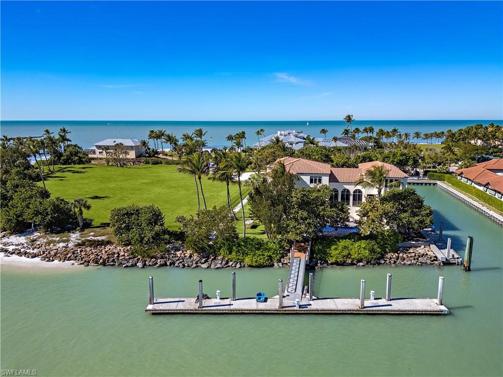 Gordon Pointe. The most unique, exceptional offering in Florida, and quite possibly the entire United States. The capstone of the storied Gordon Drive in Port Royal, Naples FL. Located on the southern tip, this offering is for 230 and 240 Bay Rd; an existing home and vacant lot adjacent. 230/240 boasts a 111' foot floating t-dock, with absolutely captivating Naples Bay views. Anchored in place and moored in legacy, Gordon Pointe possesses a rare combination of scale, privacy, and protected harbor. A once in a generation opportunity to acquire the ultimate estate.