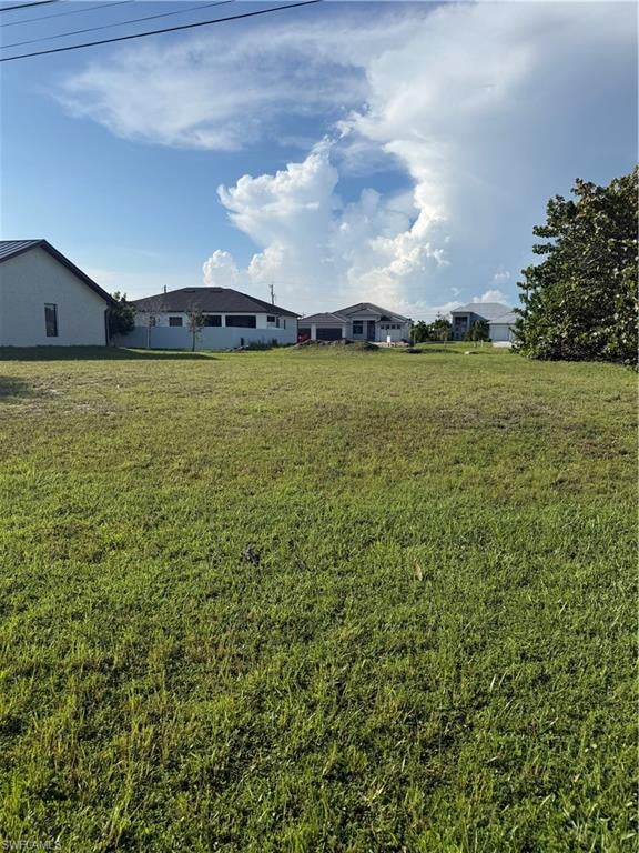 Build your Florida dream home on this *PRIME VACANT LOT* with *SOUTHERN REAR EXPOSURE* located in the highly desirable and rapidly growing NW quadrant of Cape Coral! Perfectly positioned in a quiet, modern neighborhood, this high-demand building site features *CITY WATER & SEWER UTILITY ASSESSMENTS PAID!*. Located in close proximity to Pine Island Rd and the future Seven-Islands project.