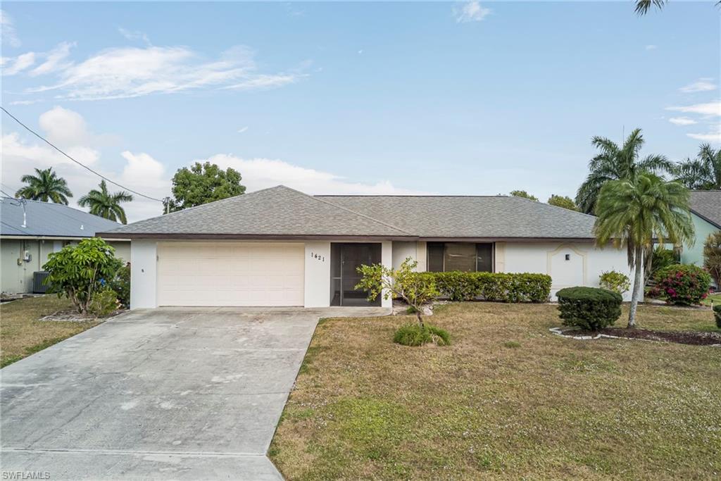 Exceptional value for a GULF ACCESS home in Cape Coral in FLOOD ZONE X and direct waterfront living at a price reflective of minor cosmetic needs. This spacious 3-bedroom, 3-bath residence provides over 1,700 square feet of living area with a desirable split floor plan designed for privacy and flexibility.

The home features both a formal living room and family room, along with dedicated dining area, creating ample space for everyday living and entertaining. The kitchen has been partially updated and offers functional workspace with opportunity for further personalization.

Recent major improvements include A/C system, and hot water heater, providing peace of mind for the next owner. Flooring throughout consists of laminate and tile, offering durability and easy maintenance.

Outdoor living is a highlight, with a screened, tiled lanai under truss, below-ground pool, and concrete dock offering quick Gulf access—ideal for boating and waterfront enjoyment. Hurricane shutters provide added storm protection.  Tallest bridge in area to open waterway!

The third bedroom and bath feature a private entrance from the garage, making it ideal for guests, in-laws, or a home office setup. Additional features include double entry doors, city water and sewer, and no assessments.

While the property requires some cosmetic updates, the price reflects the opportunity, making this one of the best values currently available for a Gulf access home in the area.