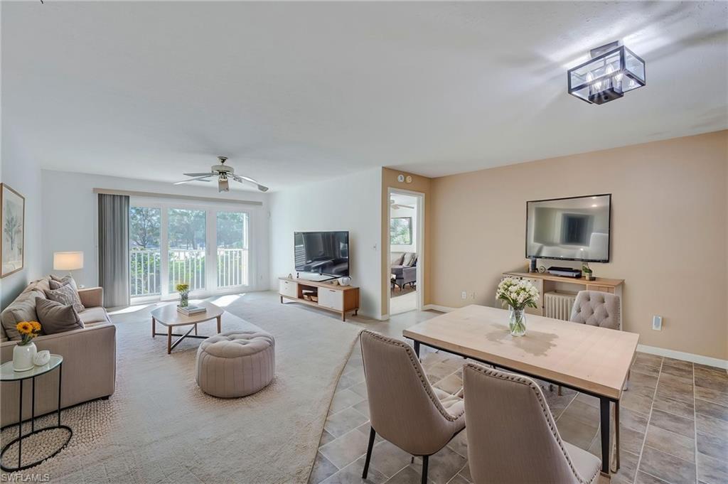 One or more photo(s) has been virtually staged, AI generated or rendered.  One or more photo(s) have been virtually staged, AI generated or rendered. 

Welcome to Berkshire Village, a well-maintained community offering 2 community pools, a tennis court, and fishing pier, with the Trafalgar satellite pool just a short distance from the unit. Nearby Golden Gate Community Park is available to meet all of your recreational needs with an aquatic complex, fitness center, soccer and baseball fields, tennis and basketball courts, playgrounds, and a dog park. 

This  lovely coach home comes with a desirable attached, private one-vehicle garage with an additional oversized storage closet providing valuable additional space rarely found available in similar homesites. Tucked within Berkshire Village sits Trafalgar Square, a small, pet-friendly, condo community with convenient access to the community pool, and the tennis/bocce ball courts, making it easy to relax and enjoy the Southwest Florida lifestyle. This 2 bedroom, 2 bathroom, second-floor, middle unit features a spacious split-bedroom floor plan, offering an open living area, a spacious primary suite with a large walk-in closet, and a primary bath ensuite with a walk-in shower.  The guest suite boasts an abundance of natural light and a large walk-in closet.  In-house laundry sits near to the kitchen and guest bedroom.  Enjoy the added convenience and peace of mind of hurricane-impact windows (2022), exterior, garage, and sliding glass doors.  Lawn care, water, and basic cable are included with your HOA, making maintenance easy-peasy!  This home offers effortless, low-maintenance Florida living with convenient access to I-75 as well as Olde Naples, putting shopping, dining, entertainment, medical care, shopping, dining, the Gulf beaches, and all that Naples has to offer within convenient reach.