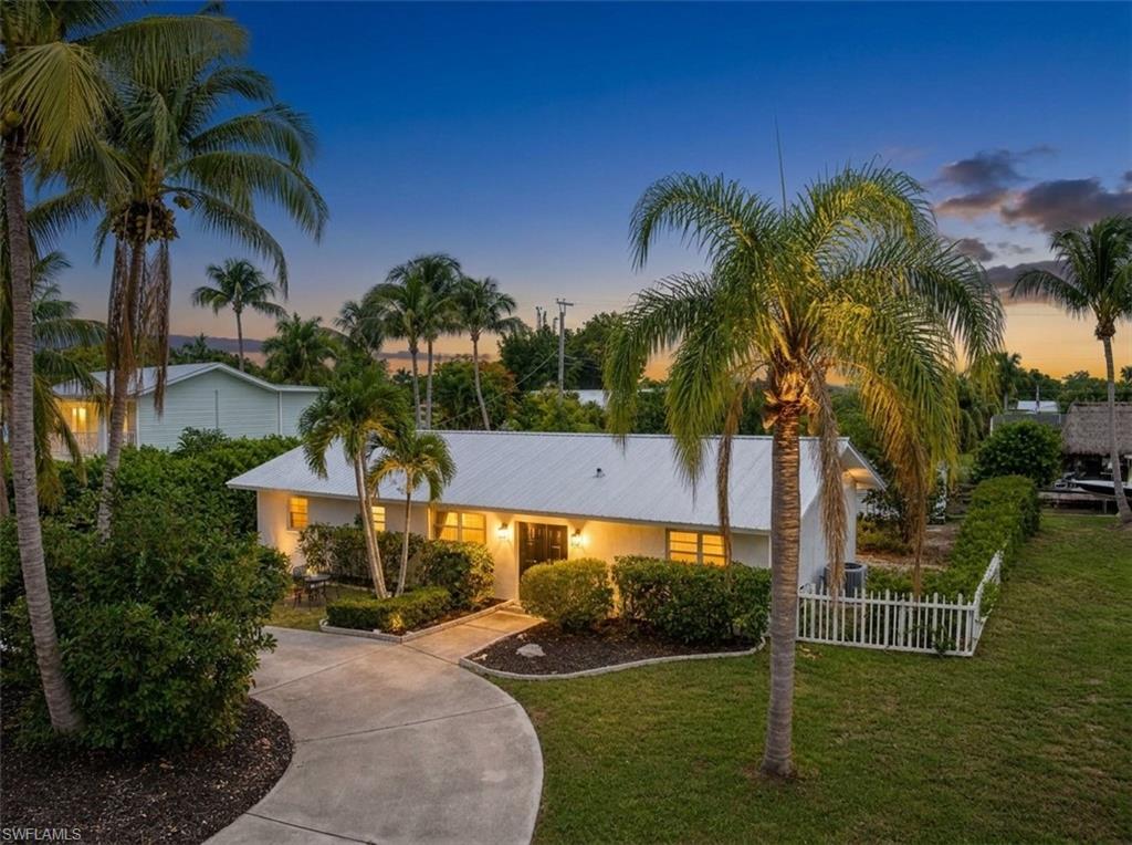 This is the perfect downsizing opportunity! Experience Gulf-Access living from the highly sought-after Whiskey Creek Canal, NO HOA! Fantastic location off of historic McGregor Blvd, located right between vibrant downtown Fort Myers and Fort Myers beaches & Sanibel Island. This beautifully remodeled (2023) waterfront pool home offers 2 bedrooms, 2 bathrooms, and a short 15-20 minute boat ride to the Caloosahatchee River. Updates include a Metal Roof (2022), a new pool liner (2023), and modern interior renovations throughout. Both bedrooms feature ensuite bathrooms, while the spacious primary suite offers an oversized walk-in closet with additional storage. NO RENTAL RESTRICTIONS and NO HOA dues! This property can serve as an income-producing Short-Term Rental/Airbnb, making it an excellent opportunity for investors, seasonal residents, or full-time homeowners alike. The backyard is perfect for enjoying the Southwest Florida lifestyle, featuring a private pool, outdoor kitchen, fishing from your dock, and boating access to the Gulf. Two additional outbuildings provide space for a workshop, hobby room, storage, or space for recreational equipment. A circular driveway and expanded paved parking area offer extra room for multiple vehicles, guests, trailers, or boat storage. This desirable location in Fort Myers offers an array of shopping, dining, entertainment, bustling Downtown Fort Myers, and famous SWFL Beaches and Sanibel Island. Schedule a showing and make an offer today!   Some photos have been virtually staged.